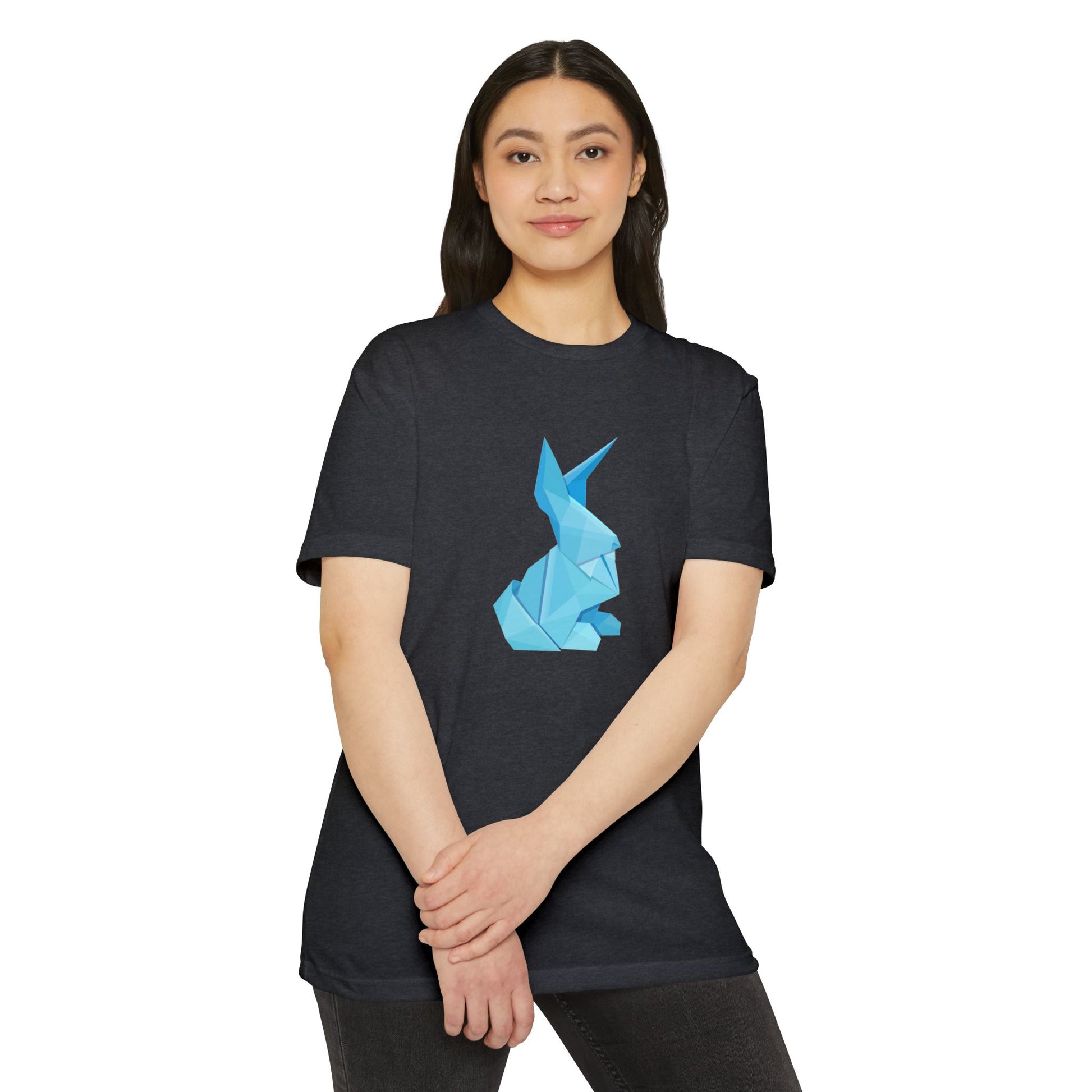 Woman in black Origami Bunny T-Shirt with blue origami bunny print, standing with arms relaxed.