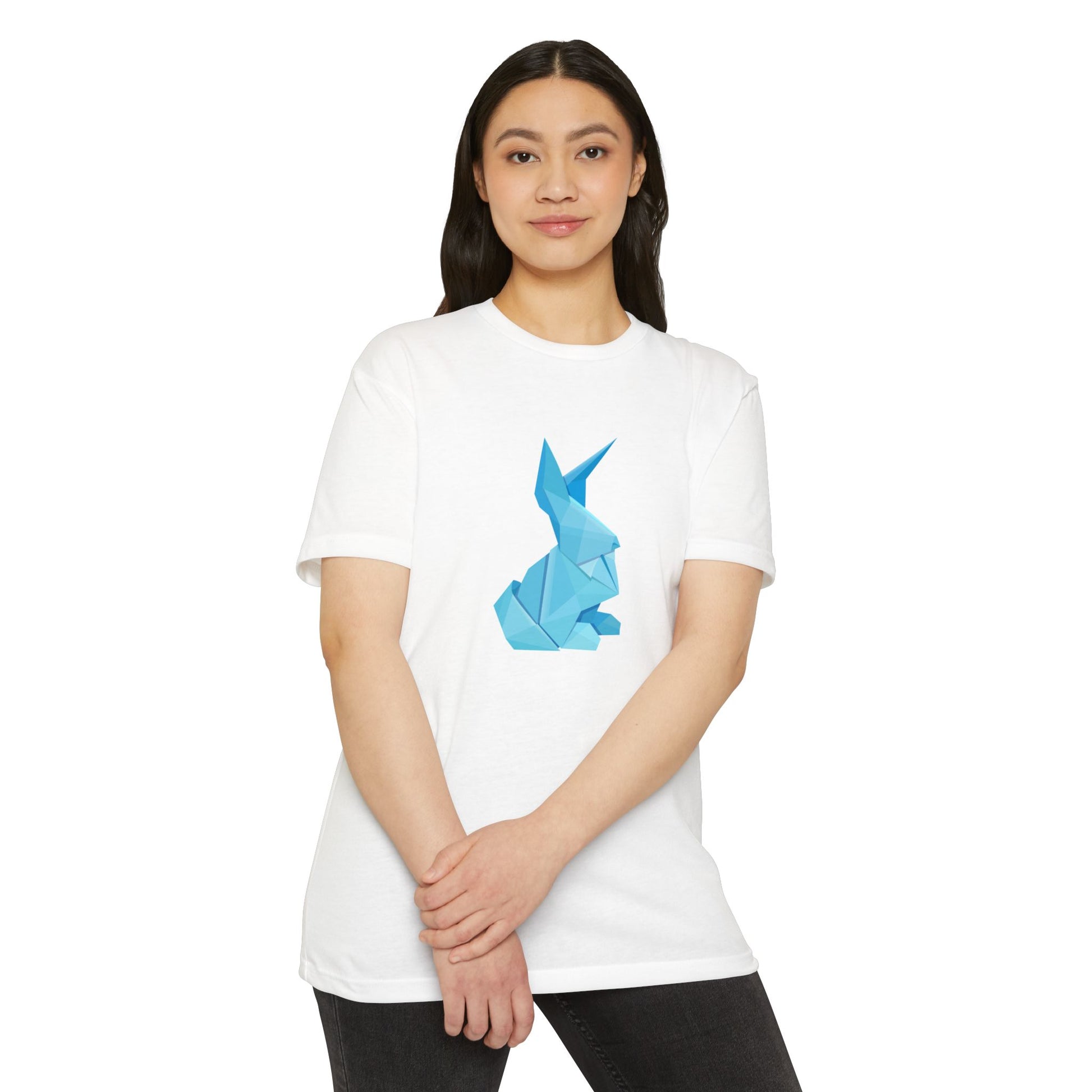 Woman wearing white Origami Bunny T-Shirt with origami bunny design, smiling with hands together.