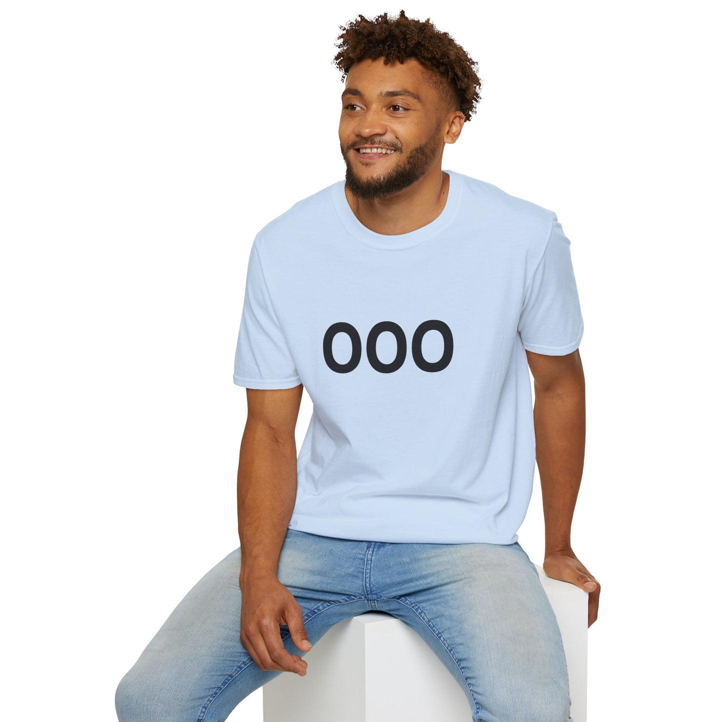Man wearing blue OOO Out of Office t-shirt seated casually