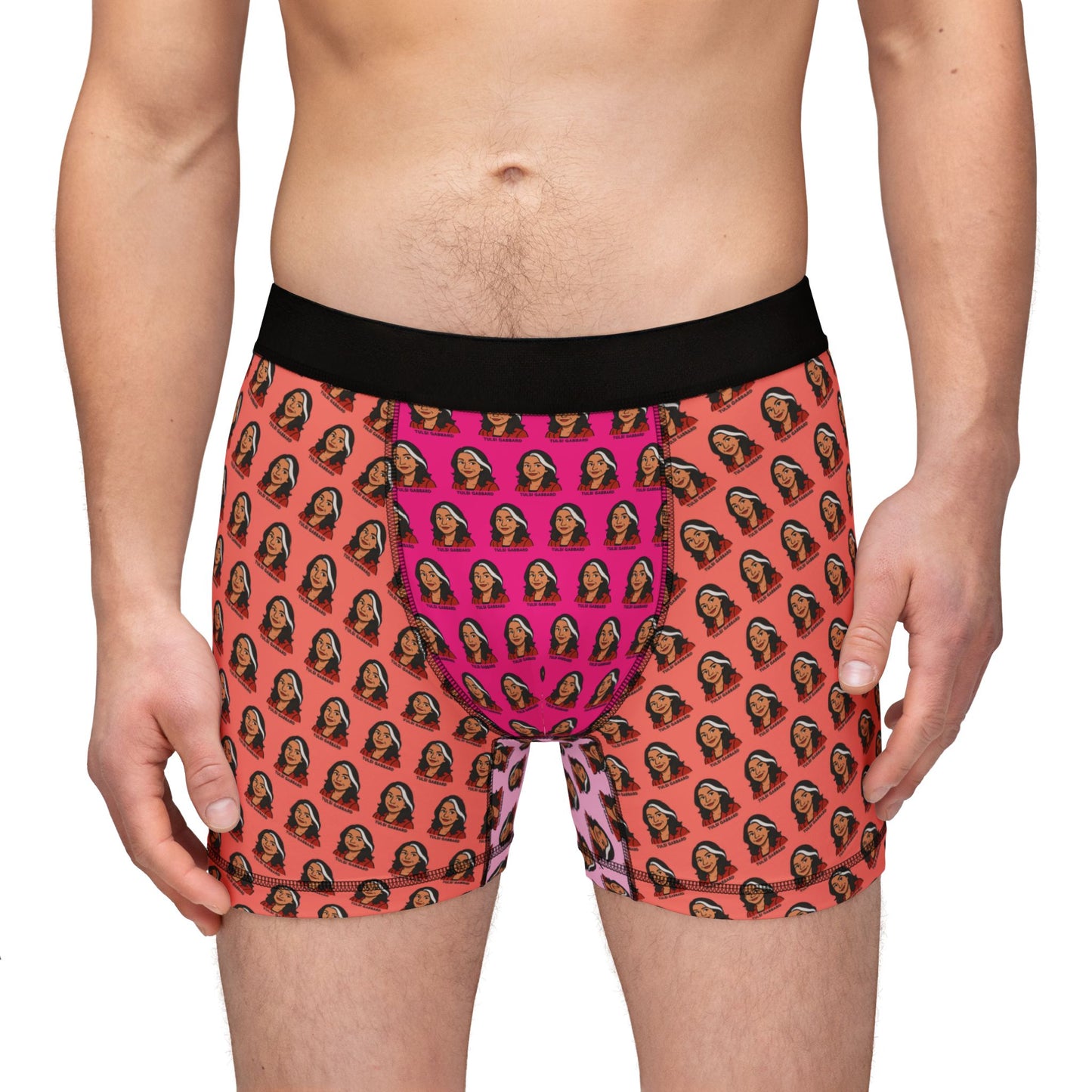 Front view of model wearing Tulsi Gabbard boxer briefs with black waistband and bright face print design