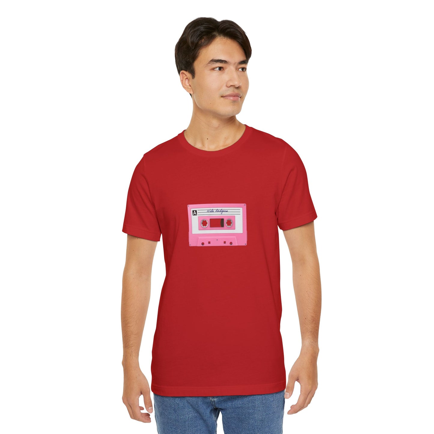 Man wearing a red t-shirt with a pink cassette tape graphic on a white background