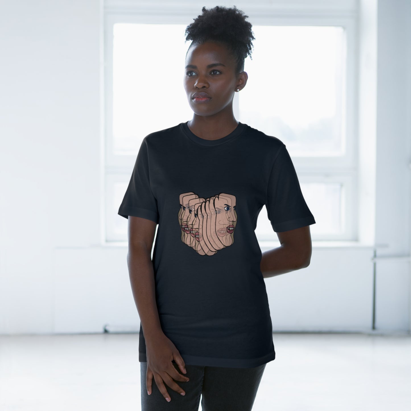 Person wearing navy blue Charlie t-shirt indoors, neutral pose
