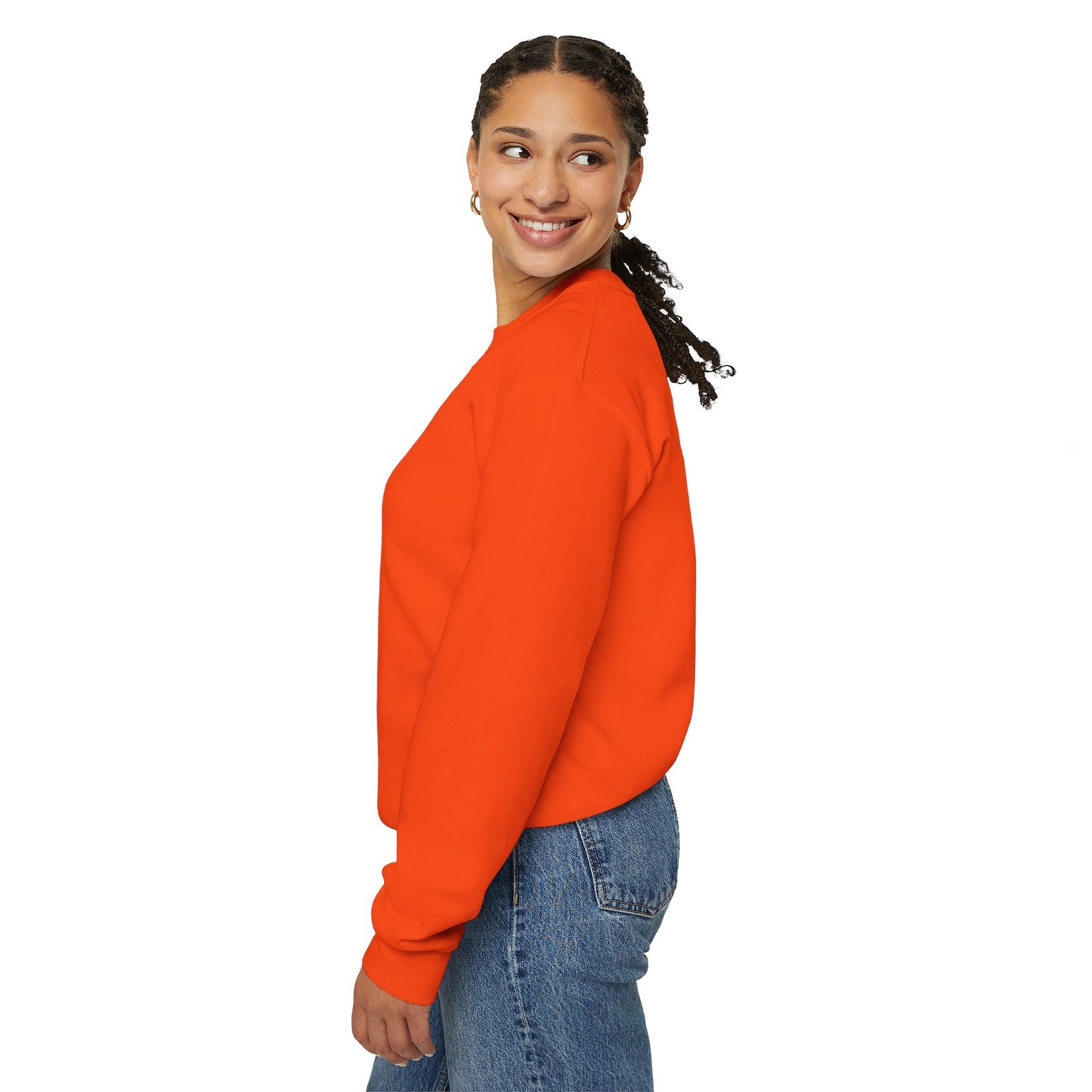 Woman in orange Lily and Matthew sweatshirt, side view.