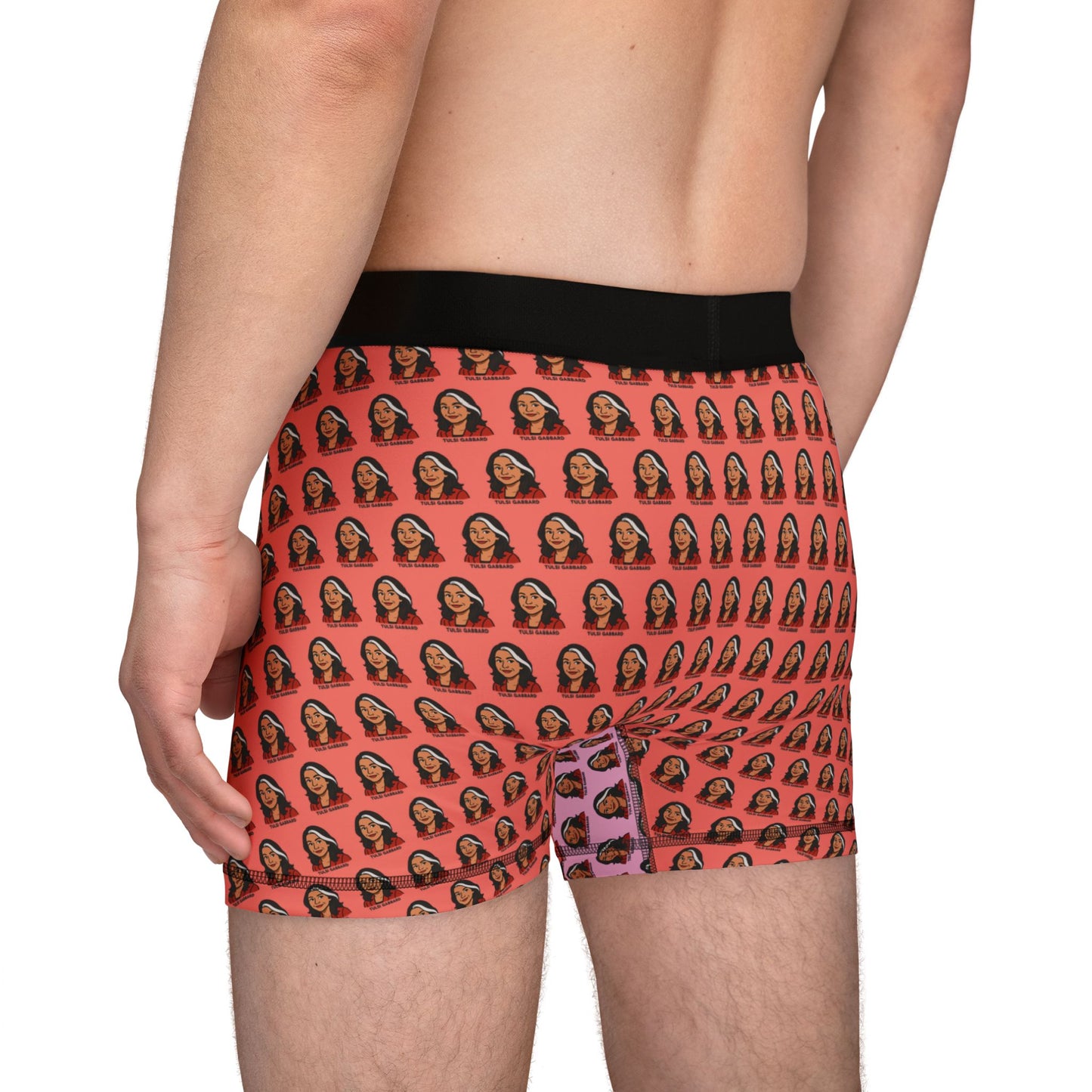 Back-side view of Tulsi Gabbard boxer briefs on model, showing orange face pattern and black trim