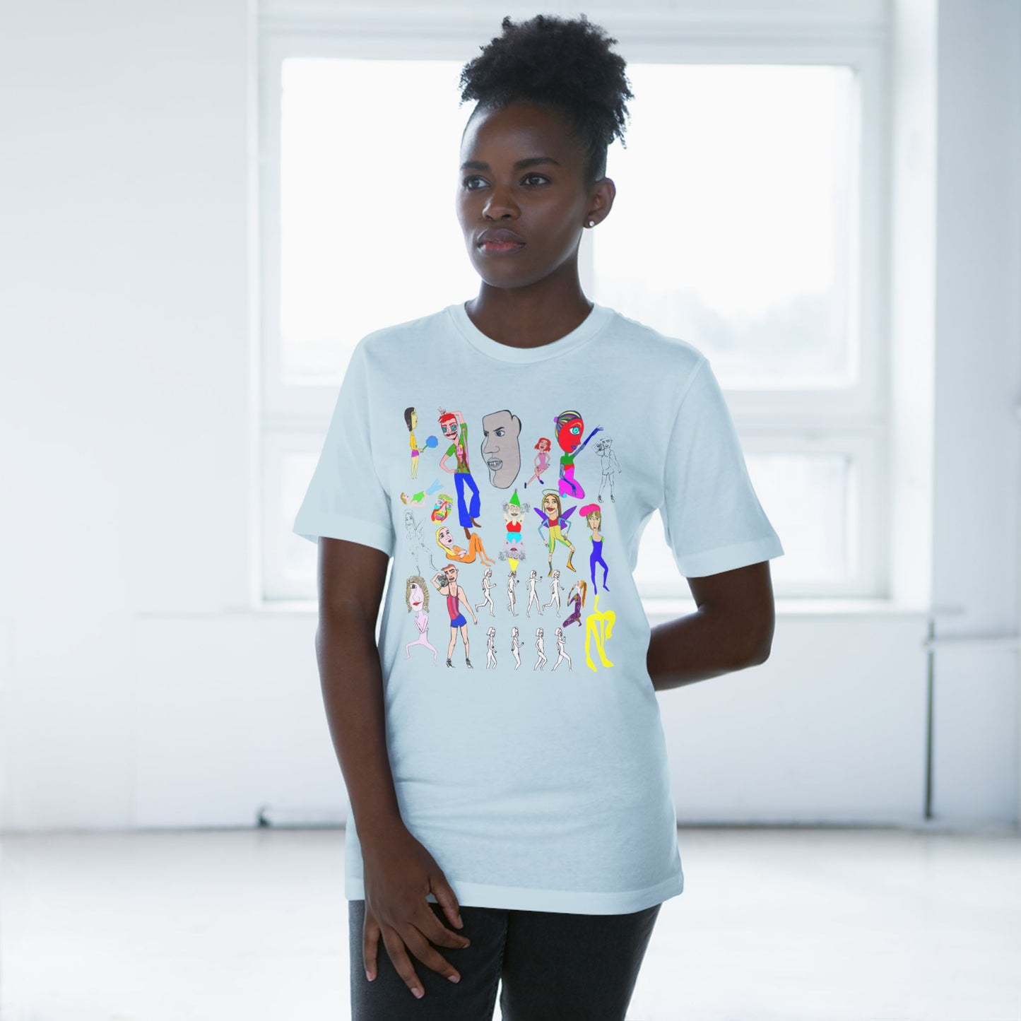 Female model wearing light blue Mix Unisex Deluxe T-Shirt with colorful artwork design.