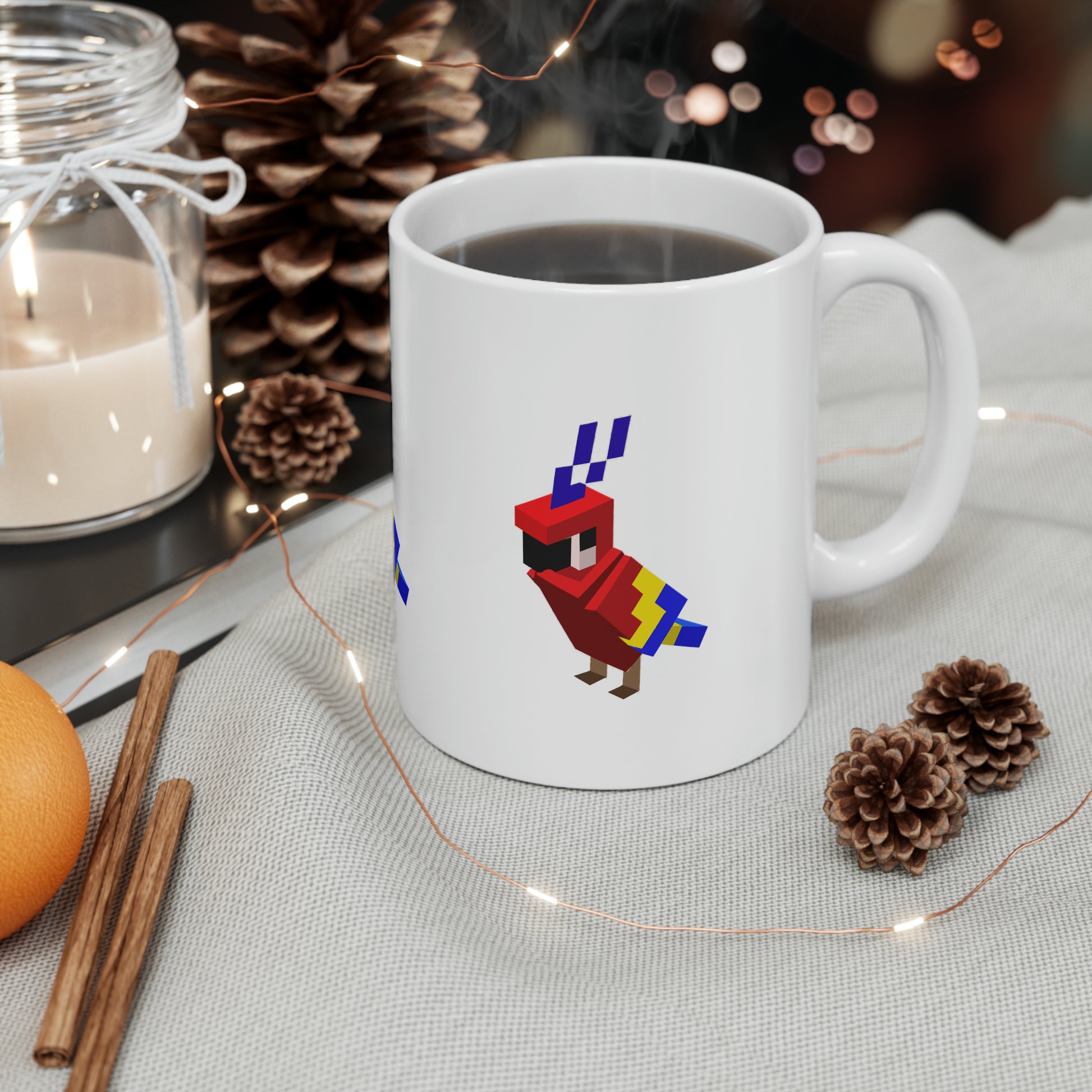 Arcade Parrot mug filled with coffee on a festive table setting, surrounded by pinecones, string lights, and cozy decor.