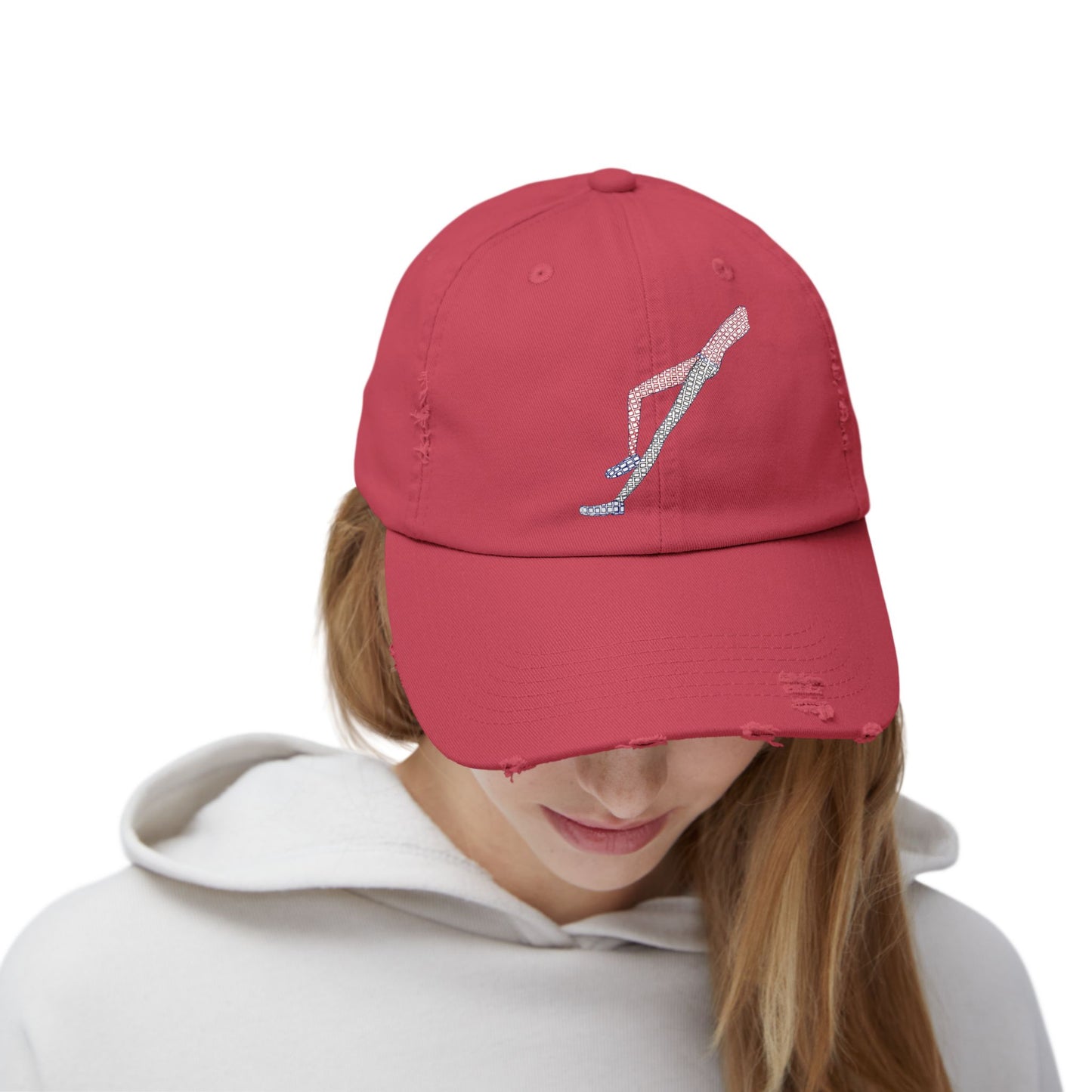 Woman adjusting red Shapes in Shapes Baseball Cap looking down