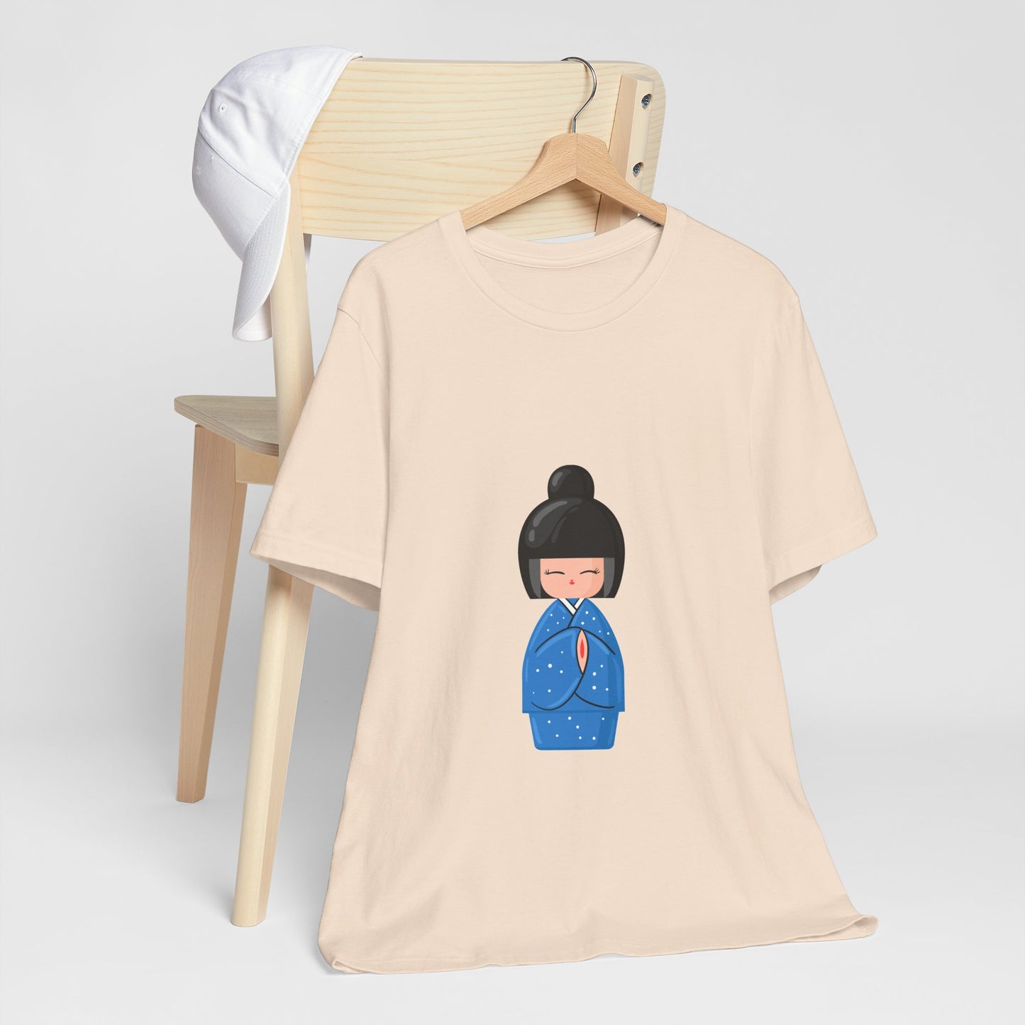Beige Geisha Blue T-Shirt displayed on chair with geisha illustration