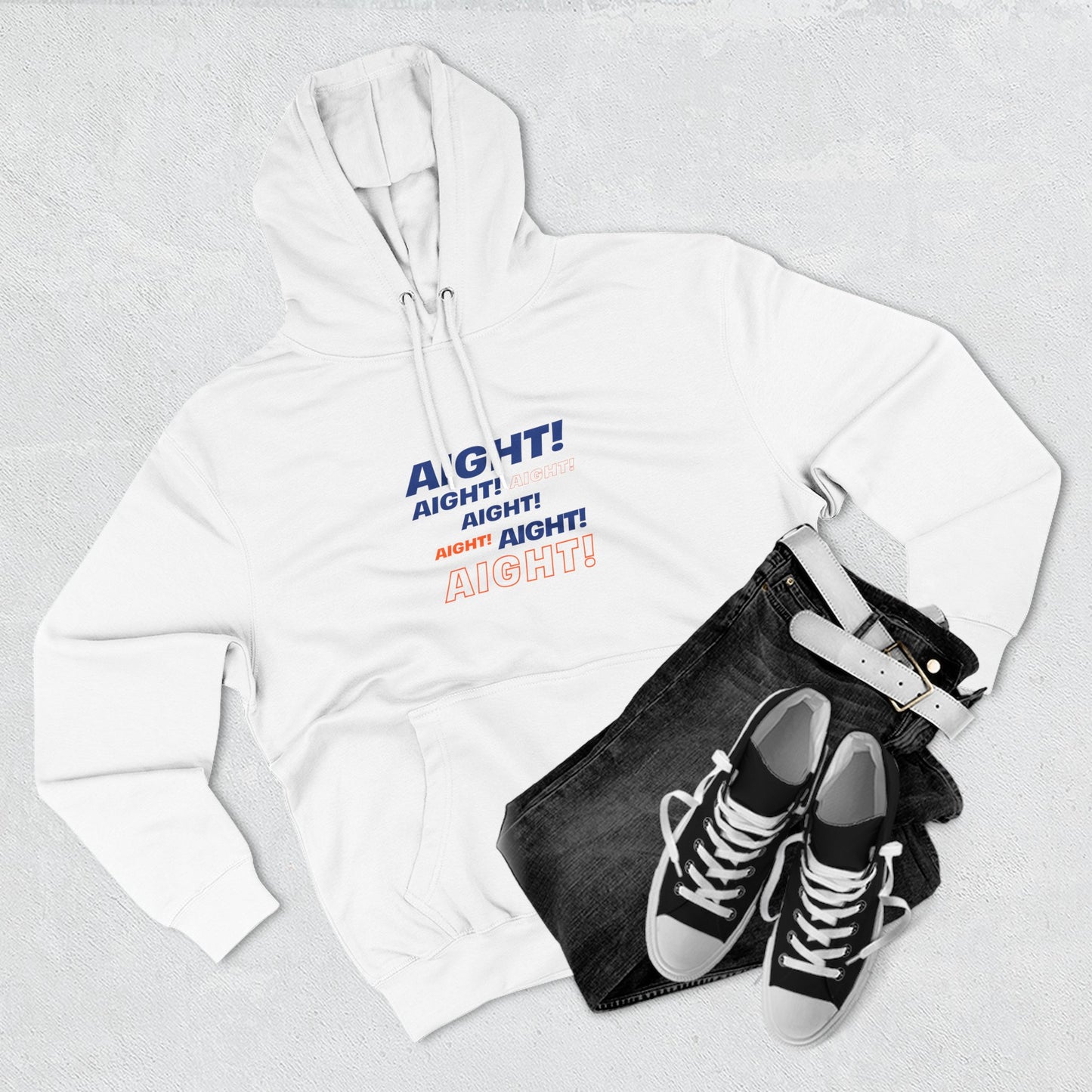Flat lay of white AIGHT hoodie with sneakers and jeans