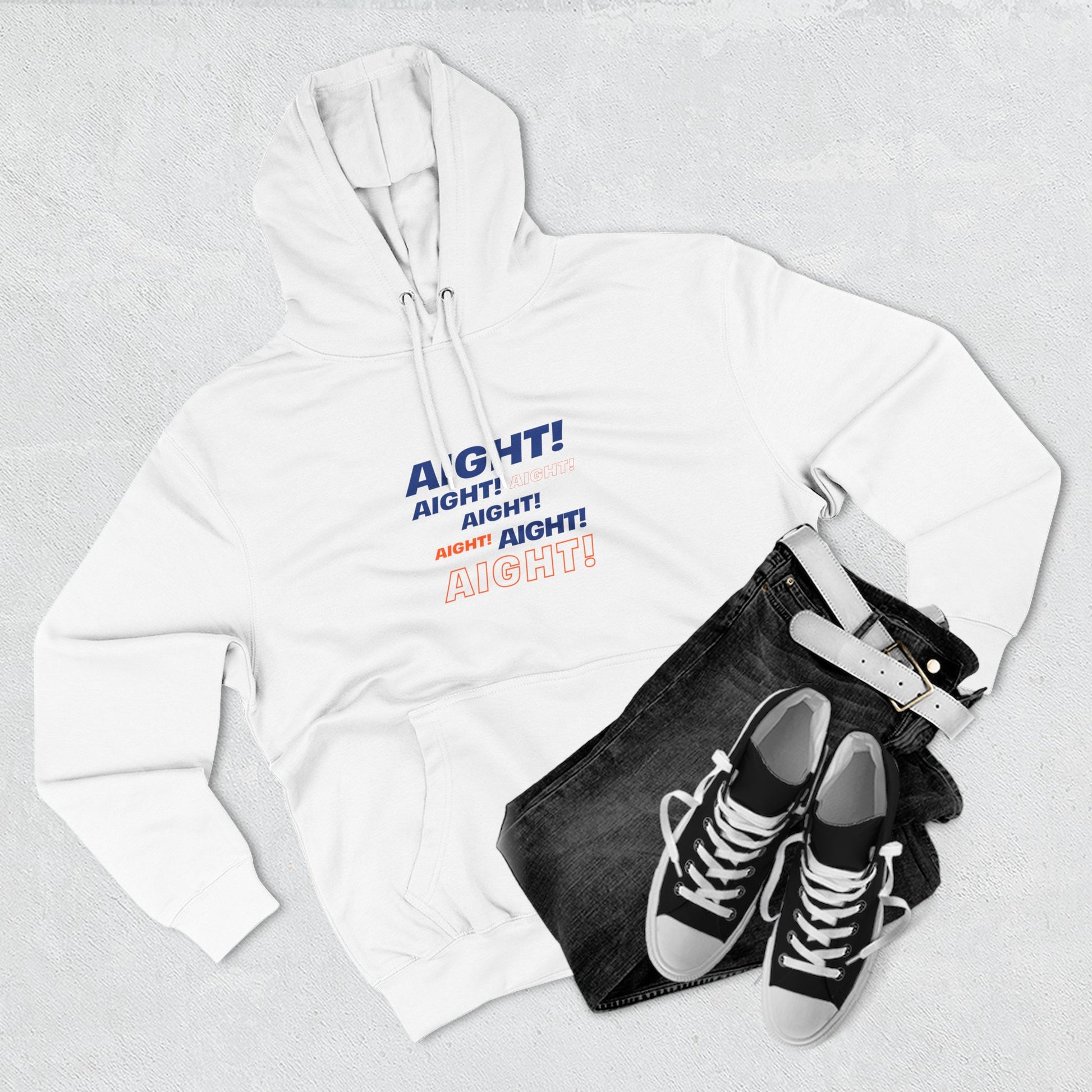 Flat lay of white AIGHT hoodie with sneakers and jeans