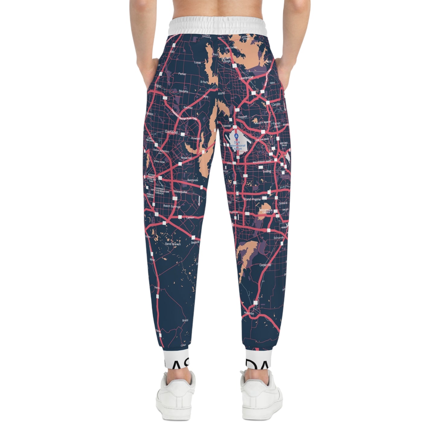 Map-patterned jogger pants worn by a person on a white background