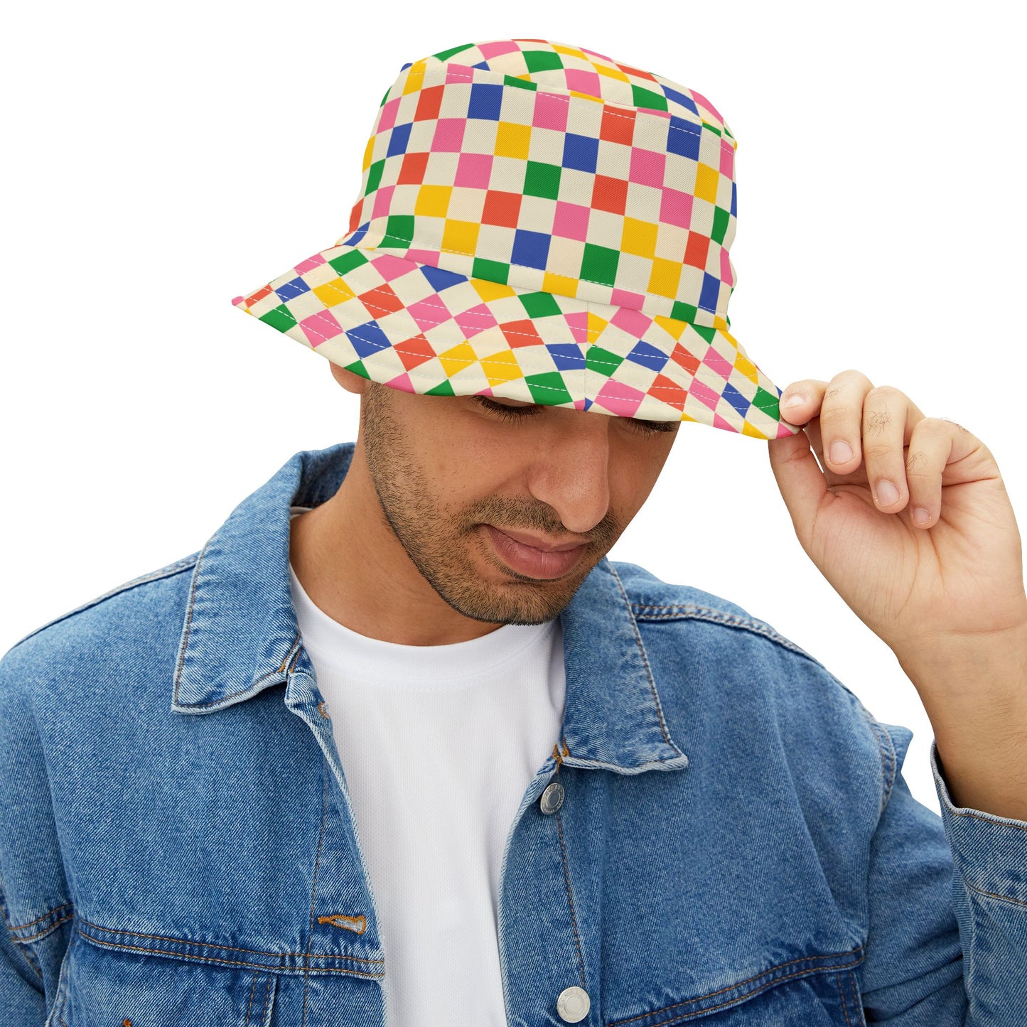 Man wearing Colored Squares Bucket Hat while holding brim.