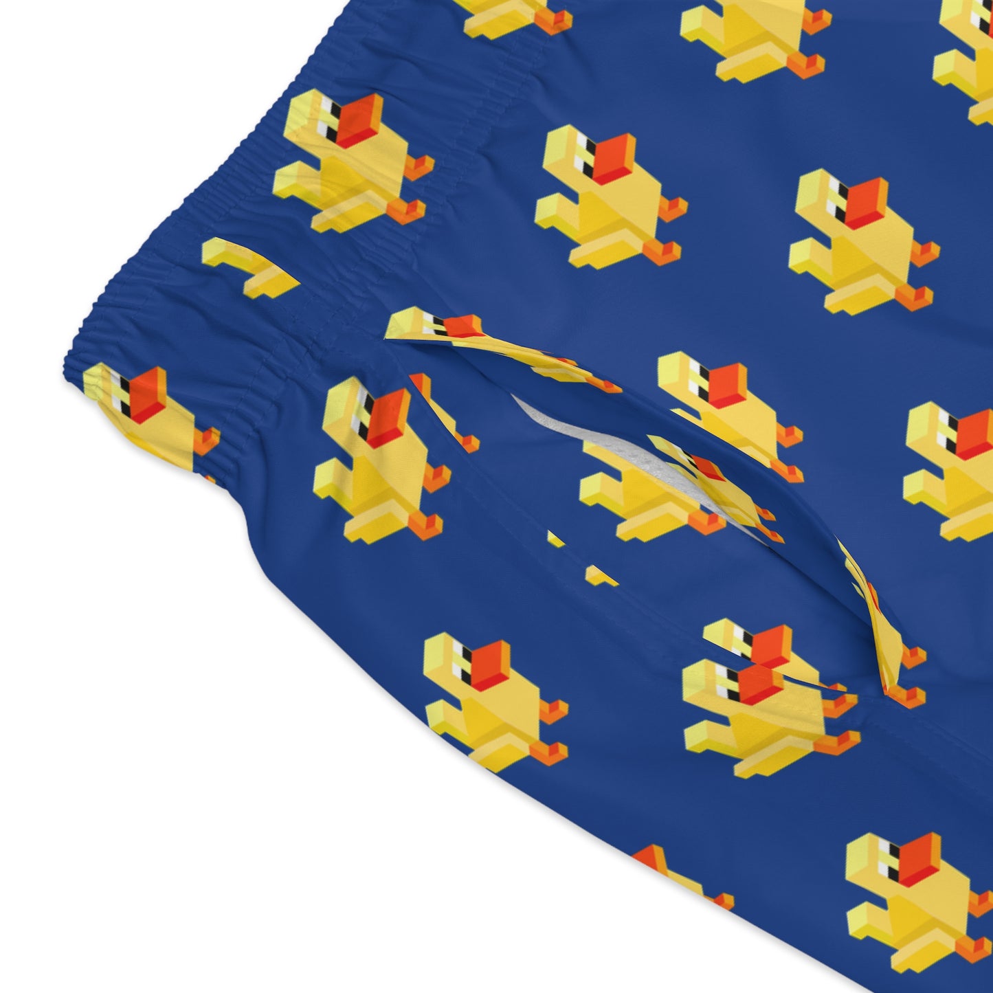 Close-up detail of the 8-bit duck print on swim trunk fabric, highlighting pixel-style duck graphics and stitching.