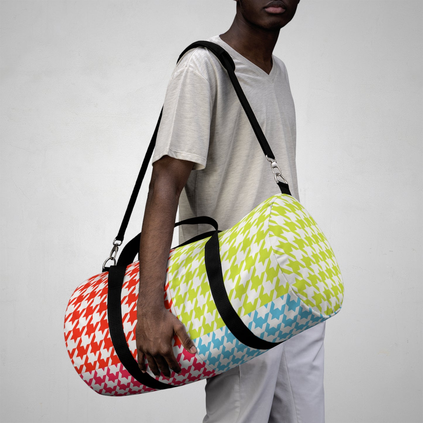 person wearing retro houndstooth duffel bag over shoulder colorful gym travel bag