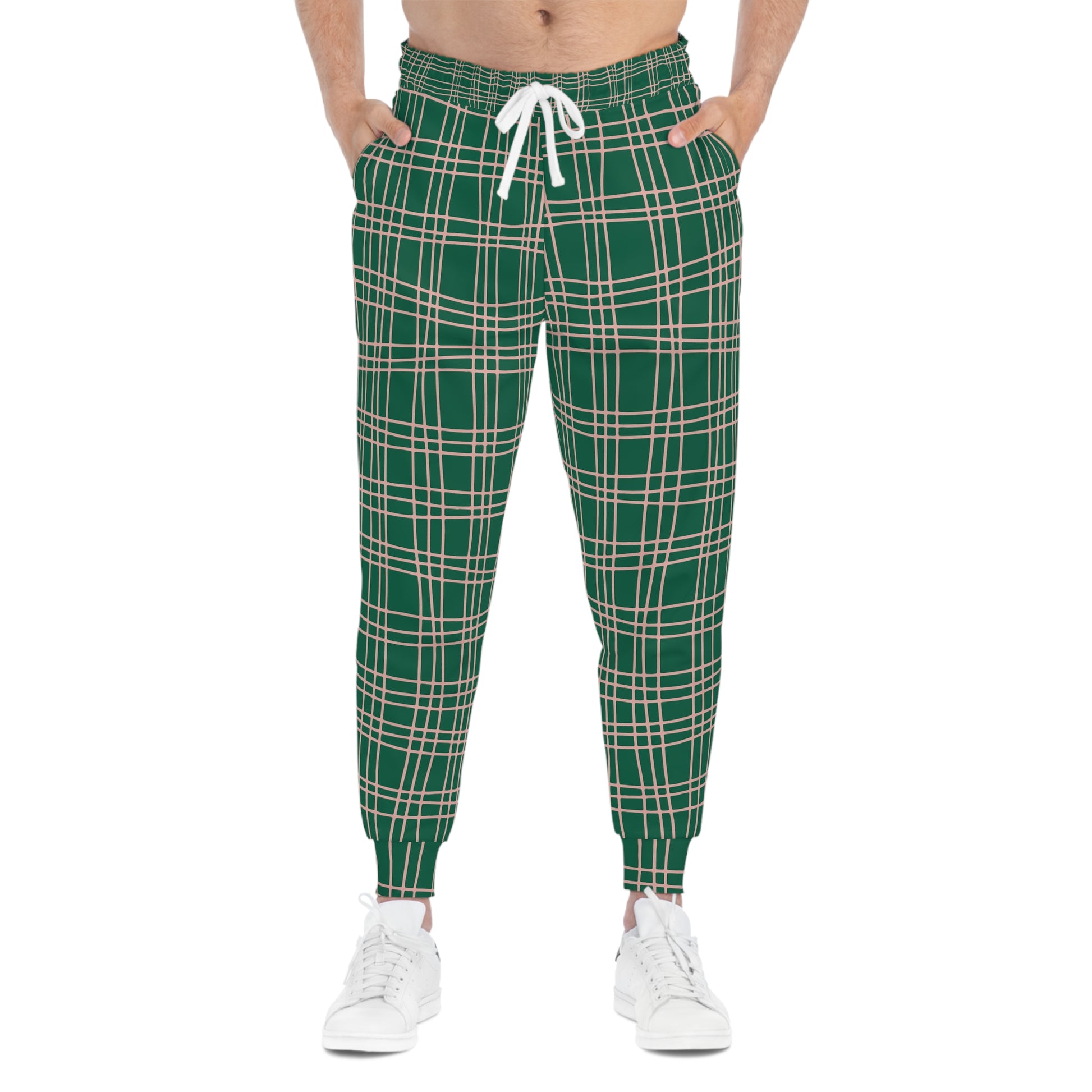 Male model wearing Green Plaid Joggers, hands in pockets, showcasing slim fit streetwear jogger style.