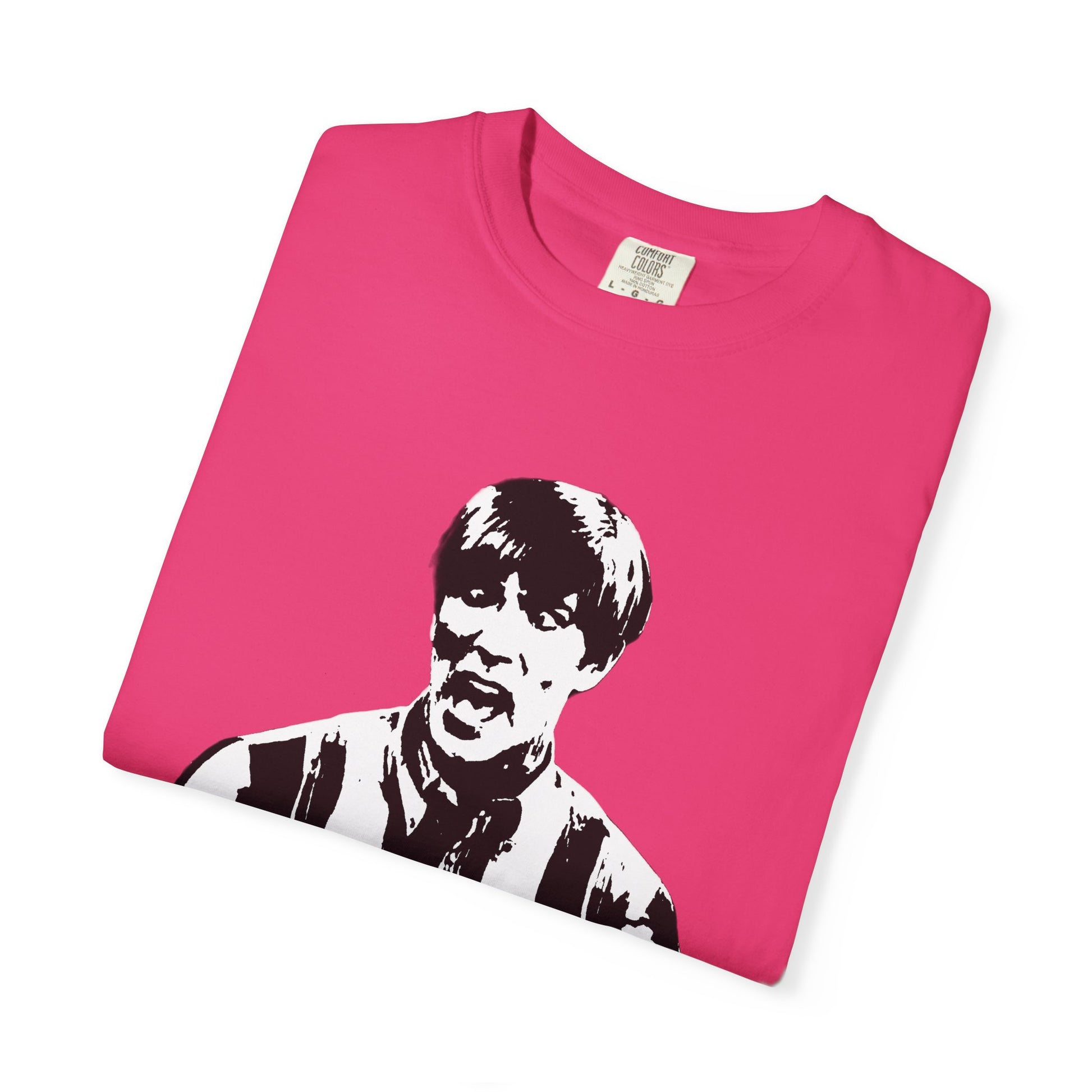 Hot pink Stuart MadTV T-shirt folded flat with black-and-white sketch comedy graphic.