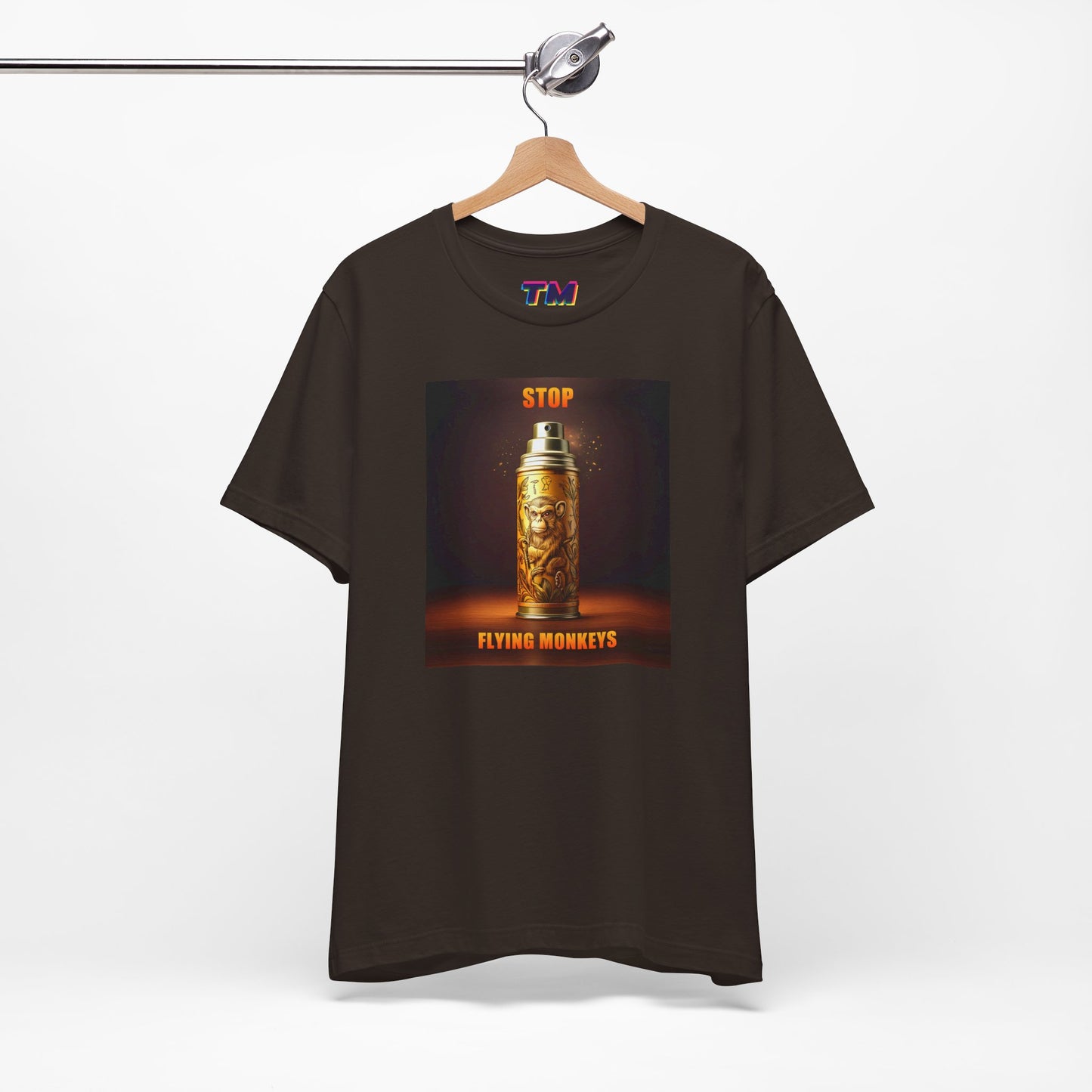Brown Stop Flying Monkeys T-Shirt on hanger with bold graphic design
