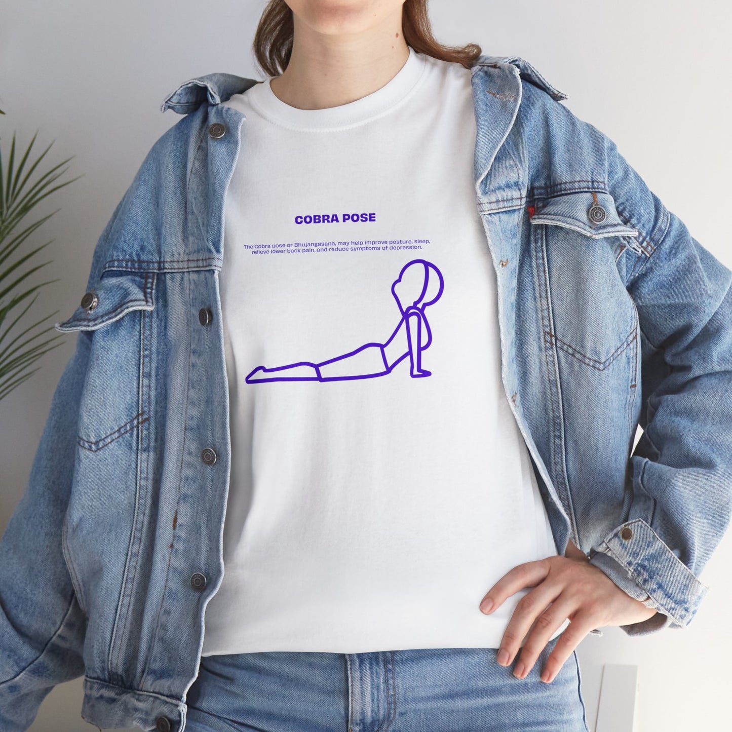 Woman wearing white Cobra Pose T-shirt with denim jacket