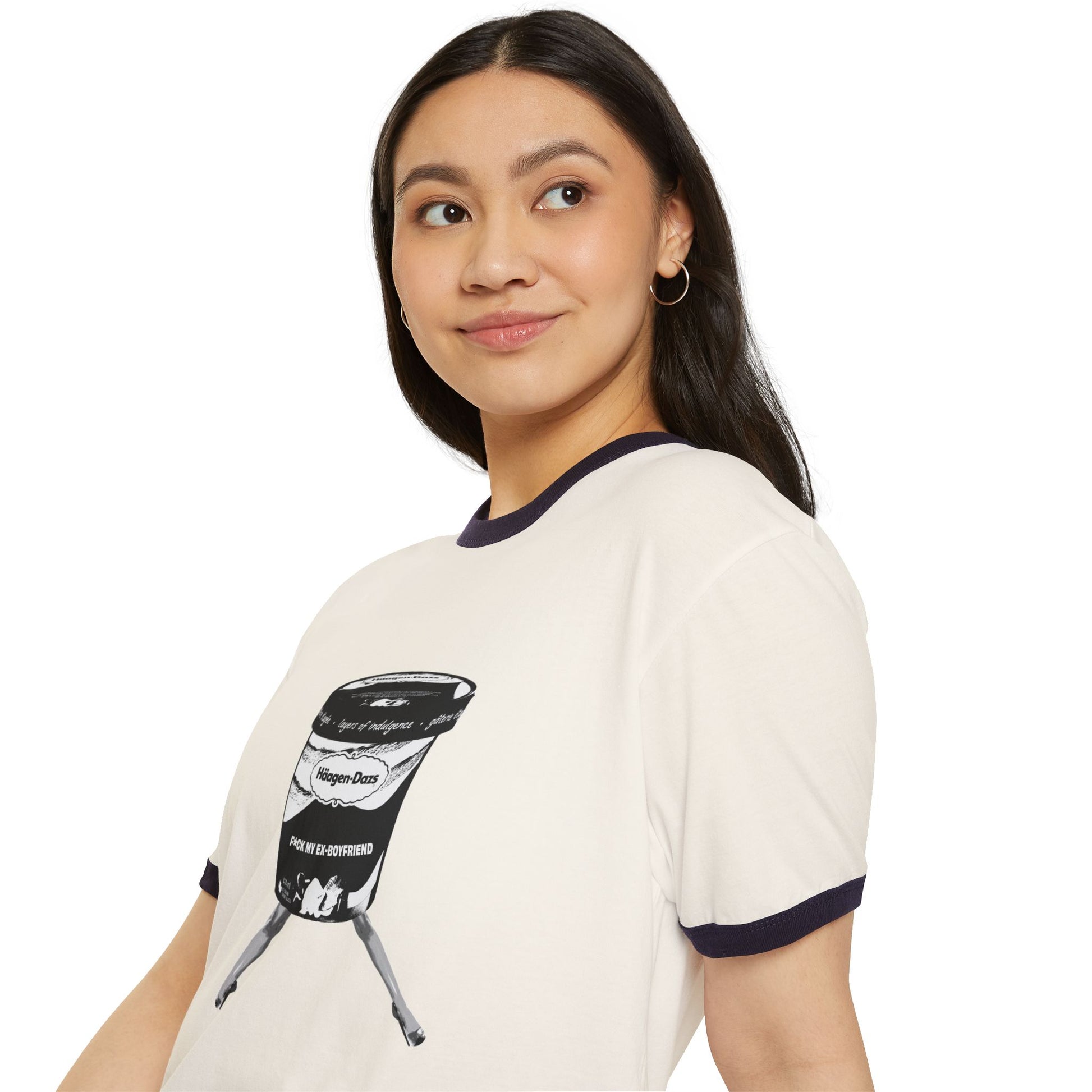 Woman side view wearing white ringer t-shirt with black trim and bold breakup print