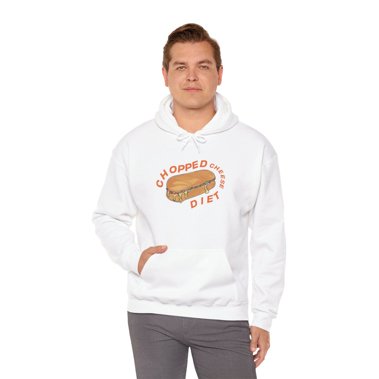 Person wearing white hoodie with “Chopped Cheese Diet” sandwich graphic, standing with one hand in pocket.