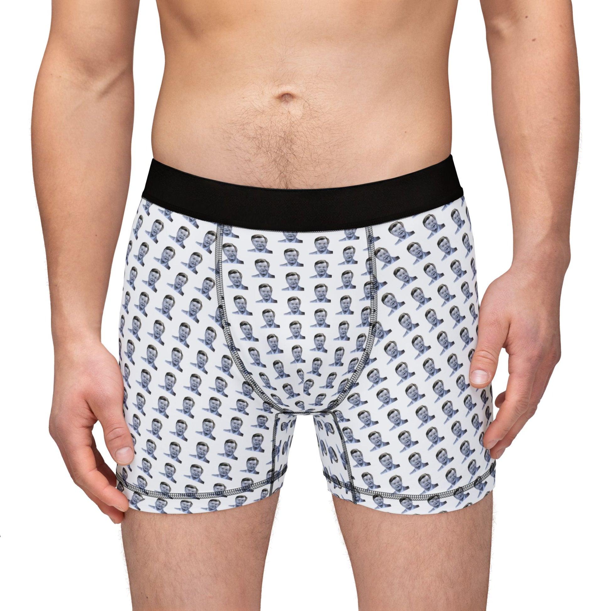 Male model front view in Benny Hill Men’s Boxers with all-over comedy print and black waistband