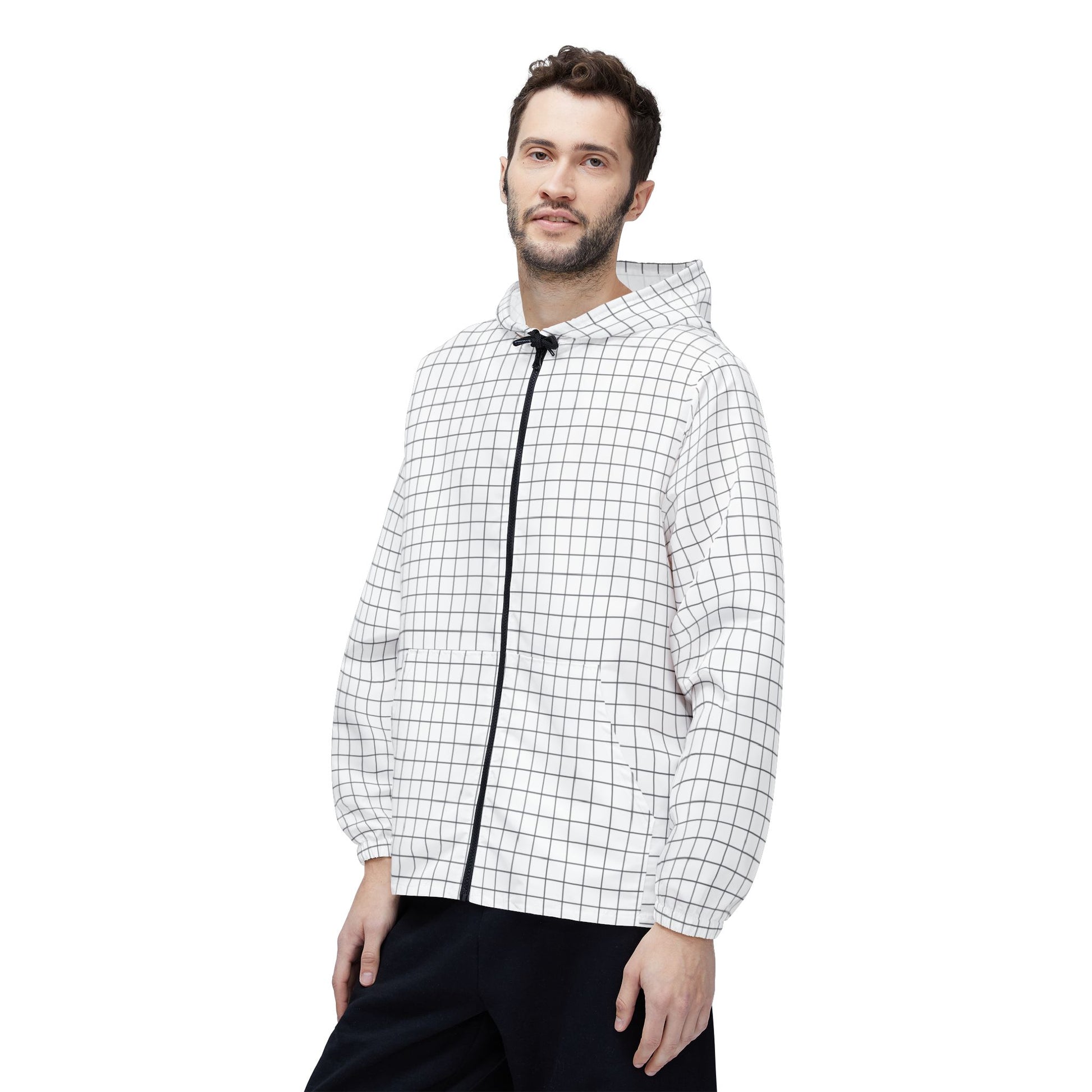 Male model front view wearing Grid Windbreaker Jacket with hands in pockets.
