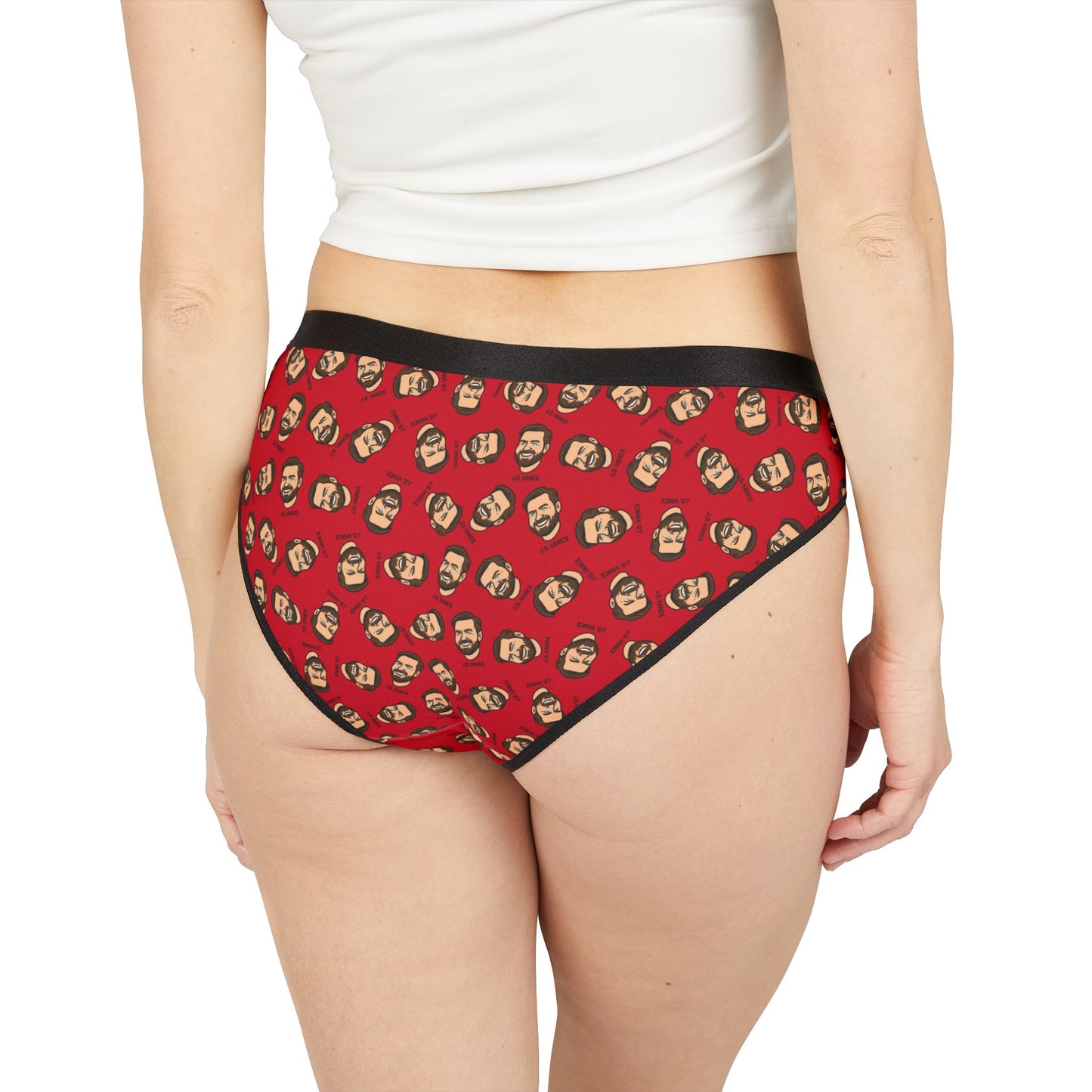 Back view of a woman wearing J.D. Vance Panties featuring a repeating cartoon face pattern on red fabric.