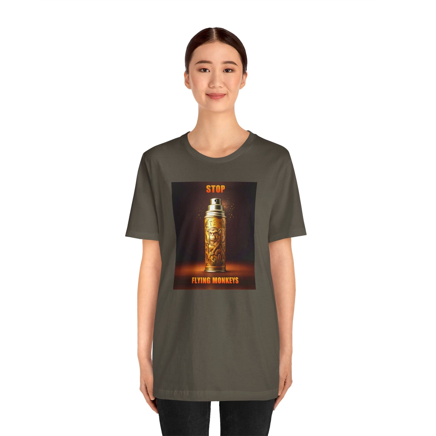 Person in olive Stop Flying Monkeys T-Shirt standing tall