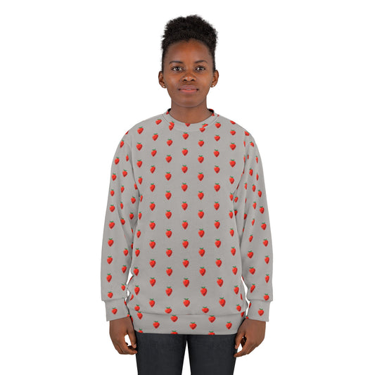 Young model wearing 8-bit Strawberry Sweatshirt with pixel strawberry print
