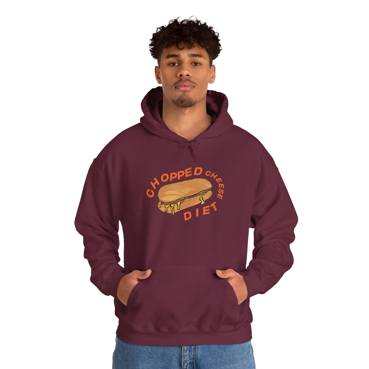 Person wearing maroon hoodie with “Chopped Cheese Diet” sandwich graphic, hands in front pocket.
