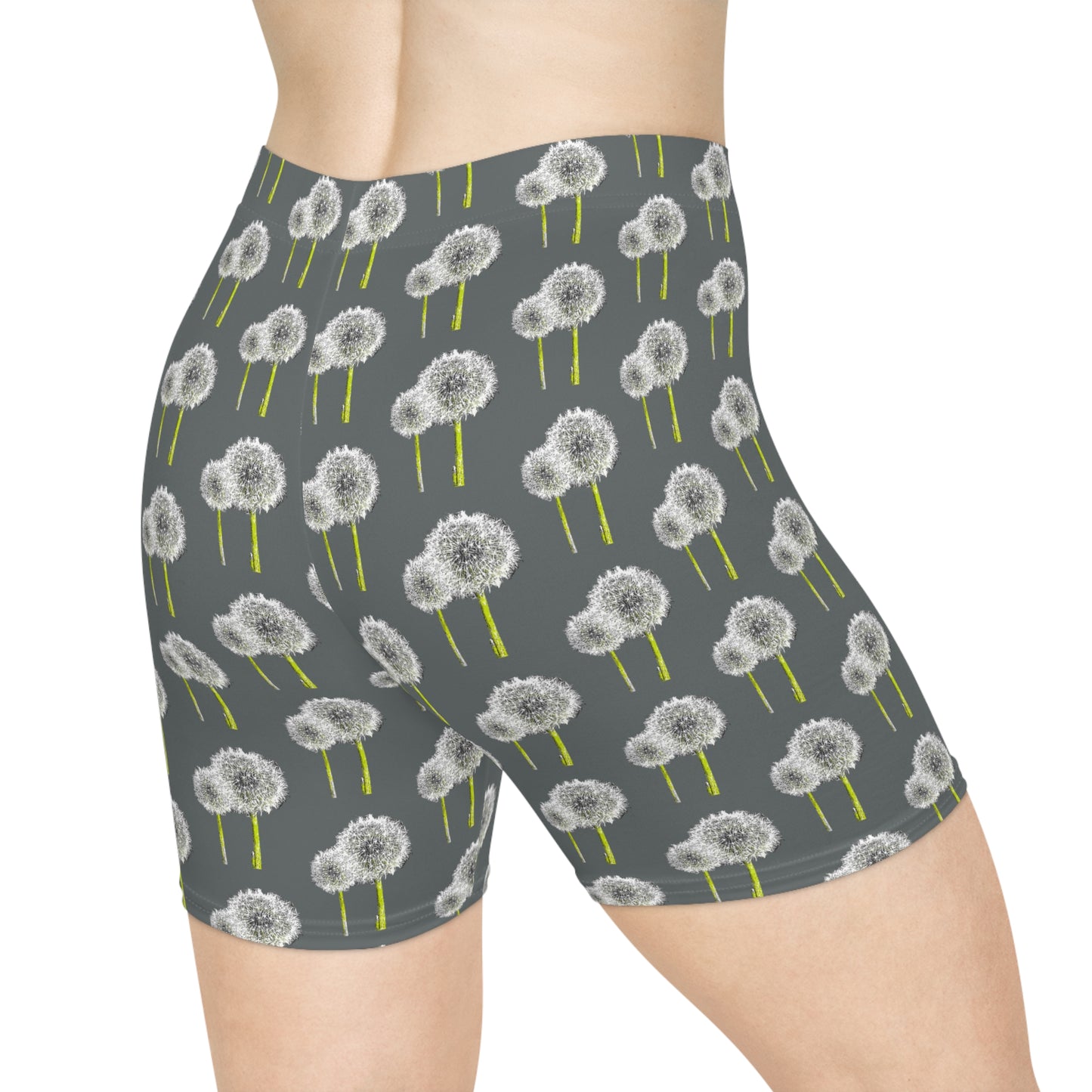Side view of women's dandelion print bike shorts with botanical pattern