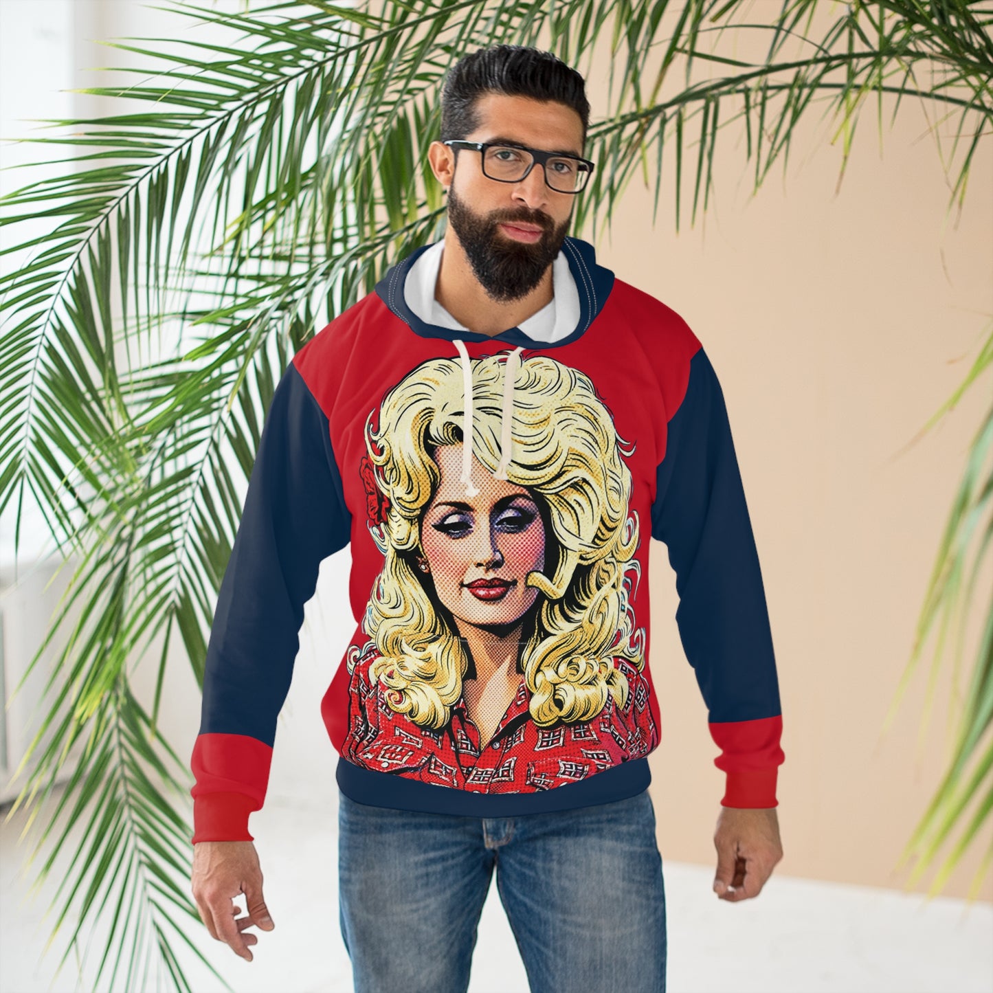 Man wearing a Dolly Parton-inspired graphic hoodie with red and navy color-block sleeves