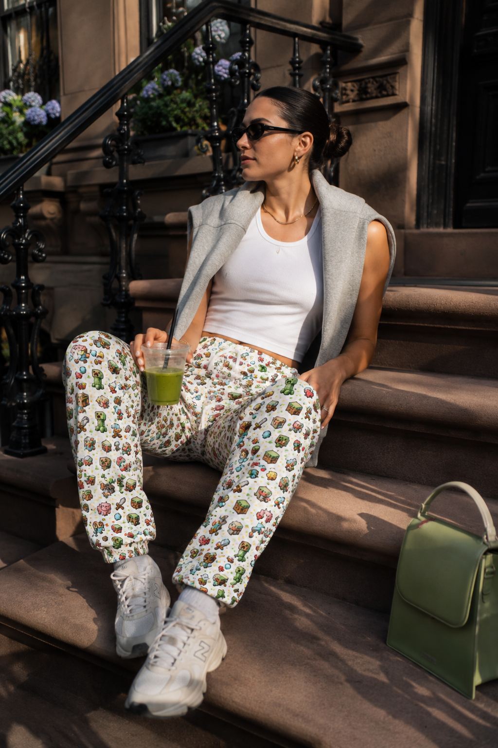 Model wearing Level Up Gamer Joggers in casual streetwear outfit with sunglasses.