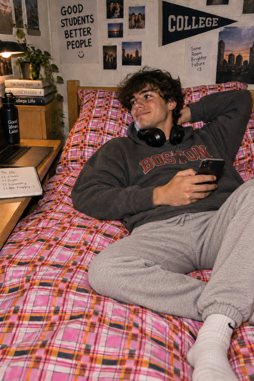 Pink plaid cotton duvet cover set in a college bedroom with young male student