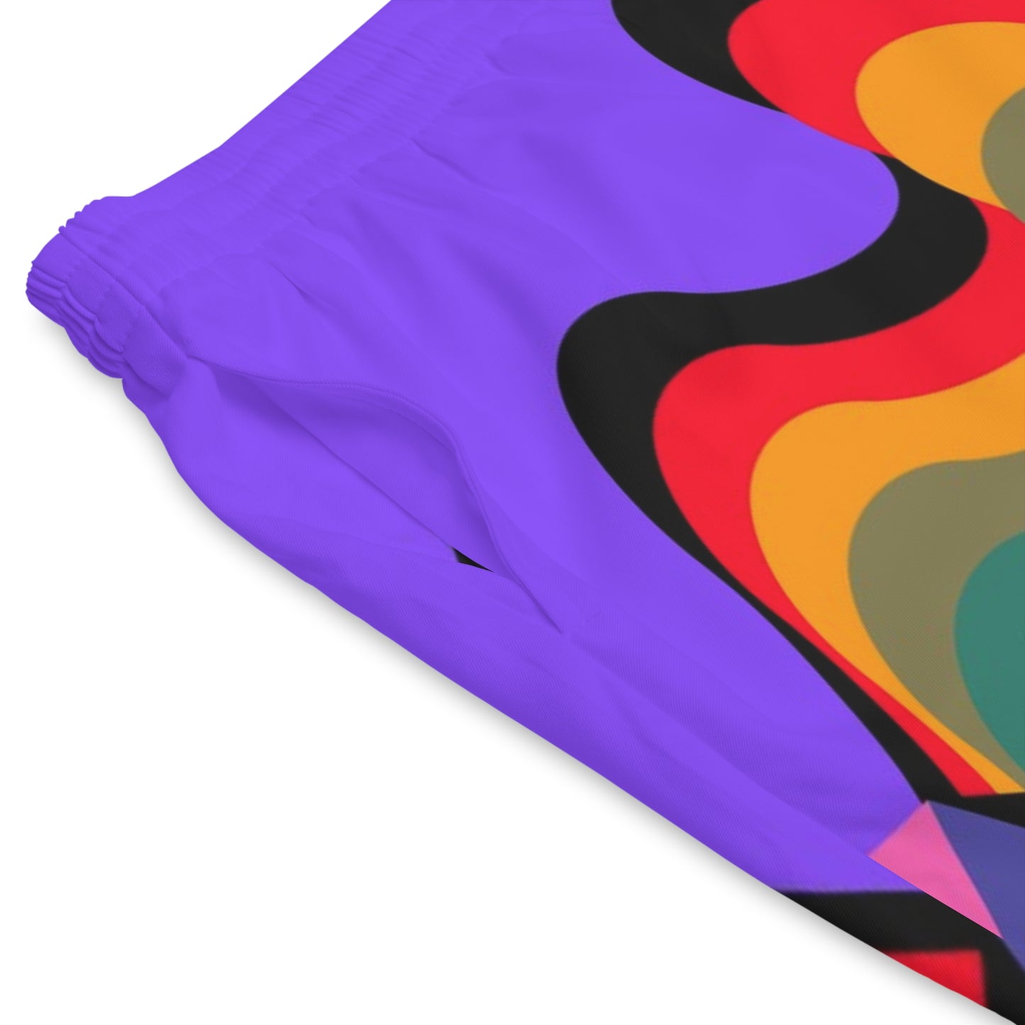 Close-up detail of colorful psychedelic wave pattern fabric on retro beach shorts