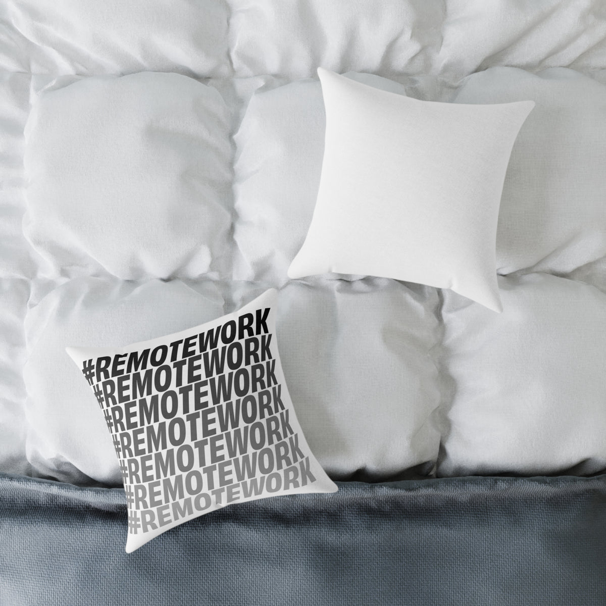 Remote Work throw pillow styled on white bedding in a contemporary bedroom