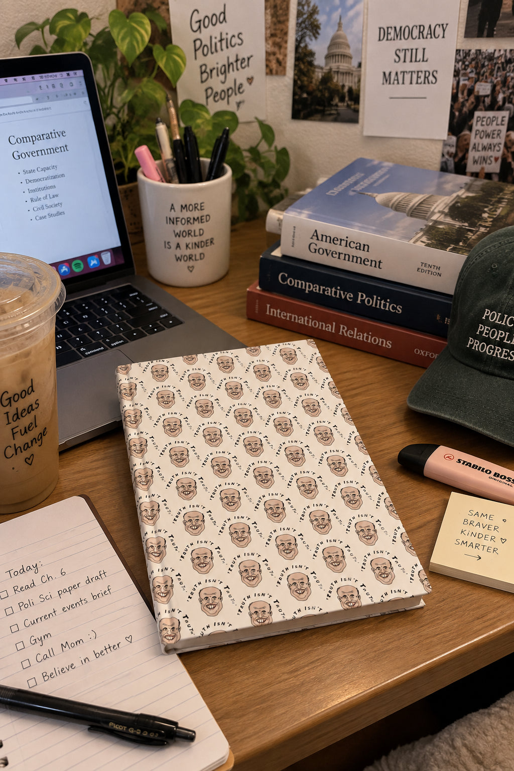 Rudy Giuliani Truth Isn’t Truth journal on a political science student desk with laptop, books and study notes