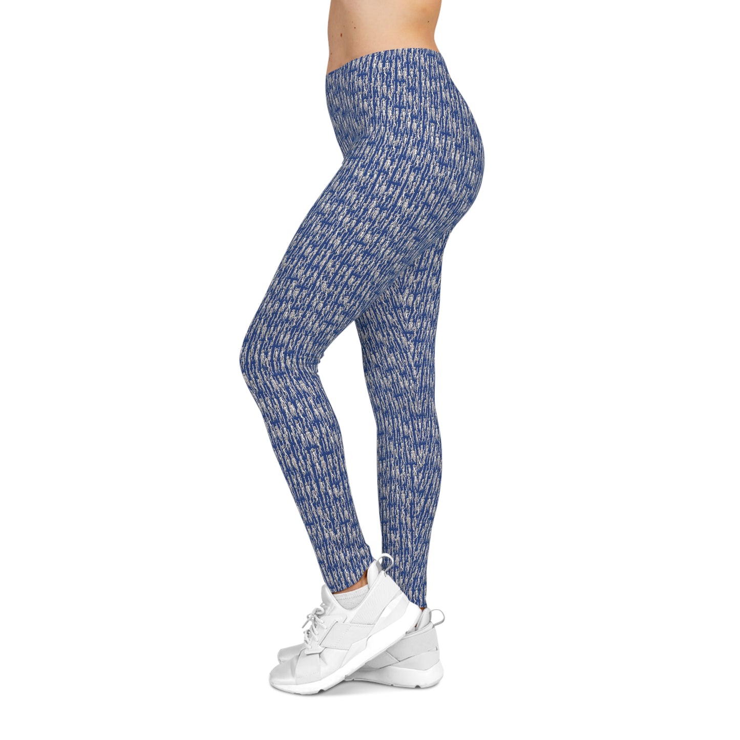 Side view of model wearing blue artistic pattern leggings with athletic styling