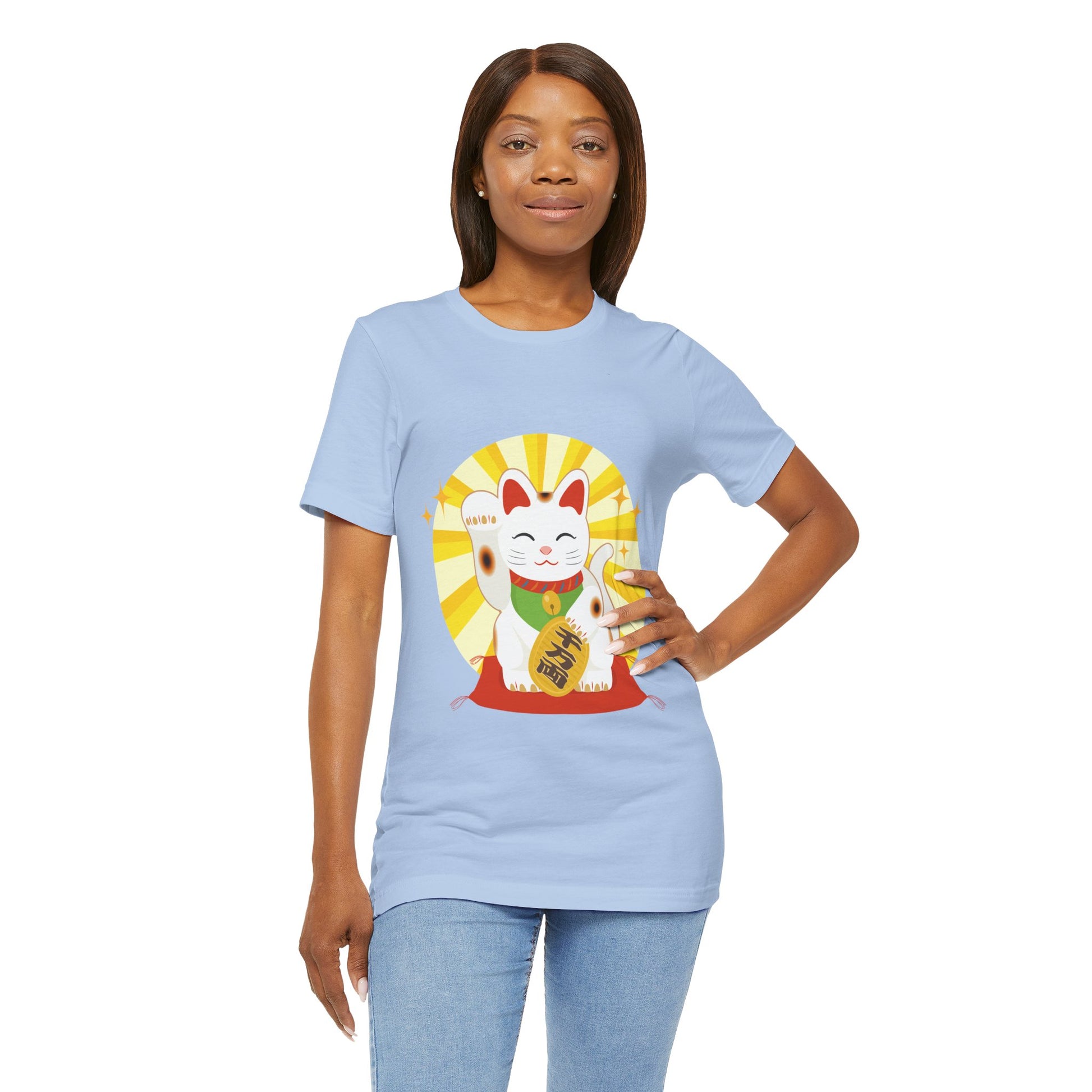 Woman wearing a light blue t-shirt with a graphic design on a white background