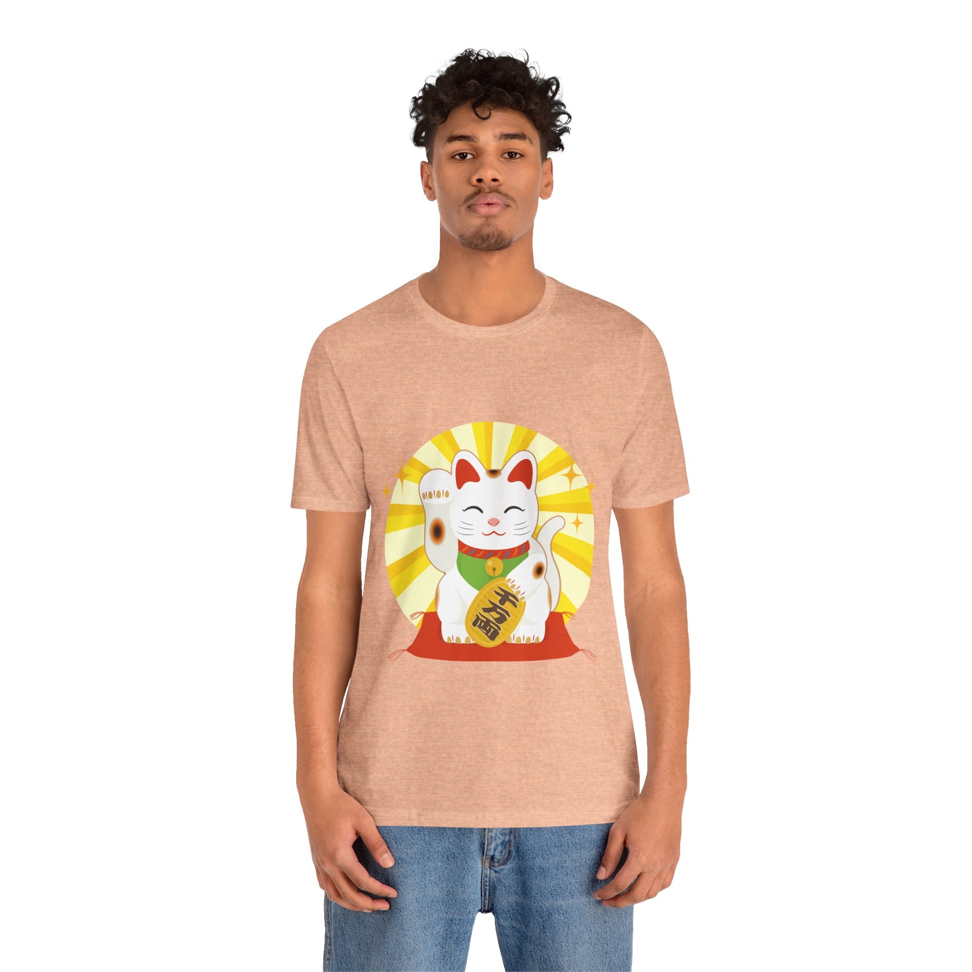 Person wearing a peach t-shirt with a graphic design on a white background