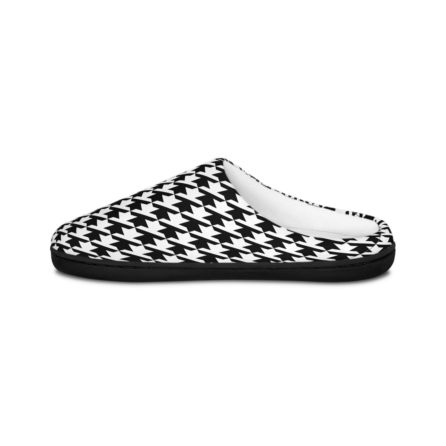 Angled side view of black and white Pied de Poule slip on slippers on white background