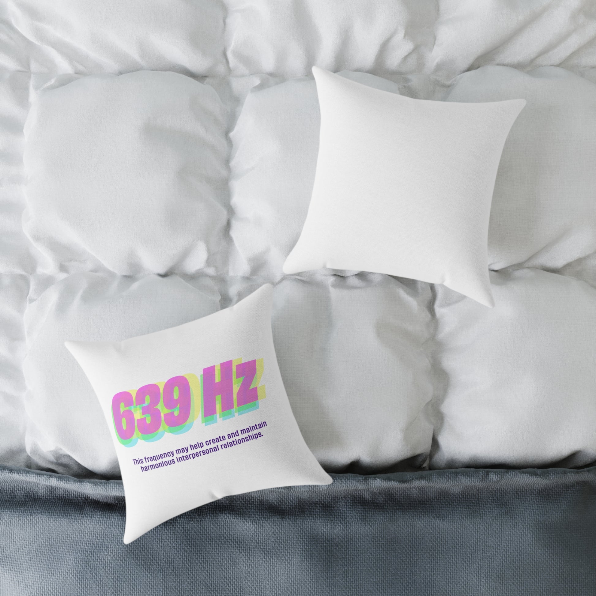 639 Hz polyester pillow displayed on a bed with cozy white bedding