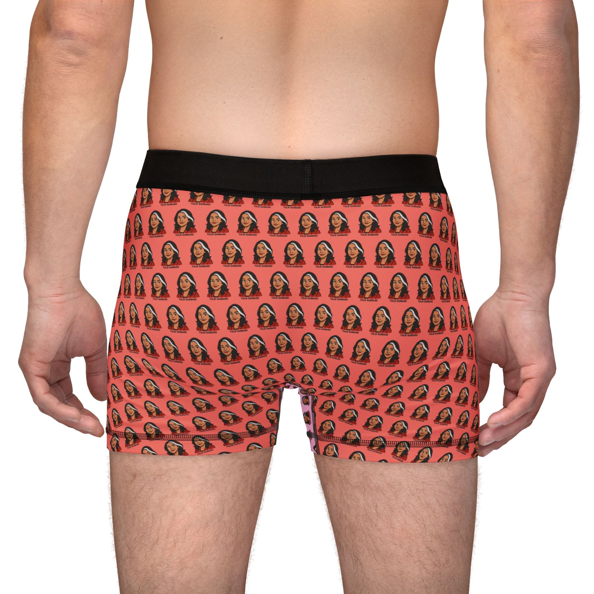 Back view of model wearing Tulsi Gabbard boxer briefs with face pattern and bold orange color