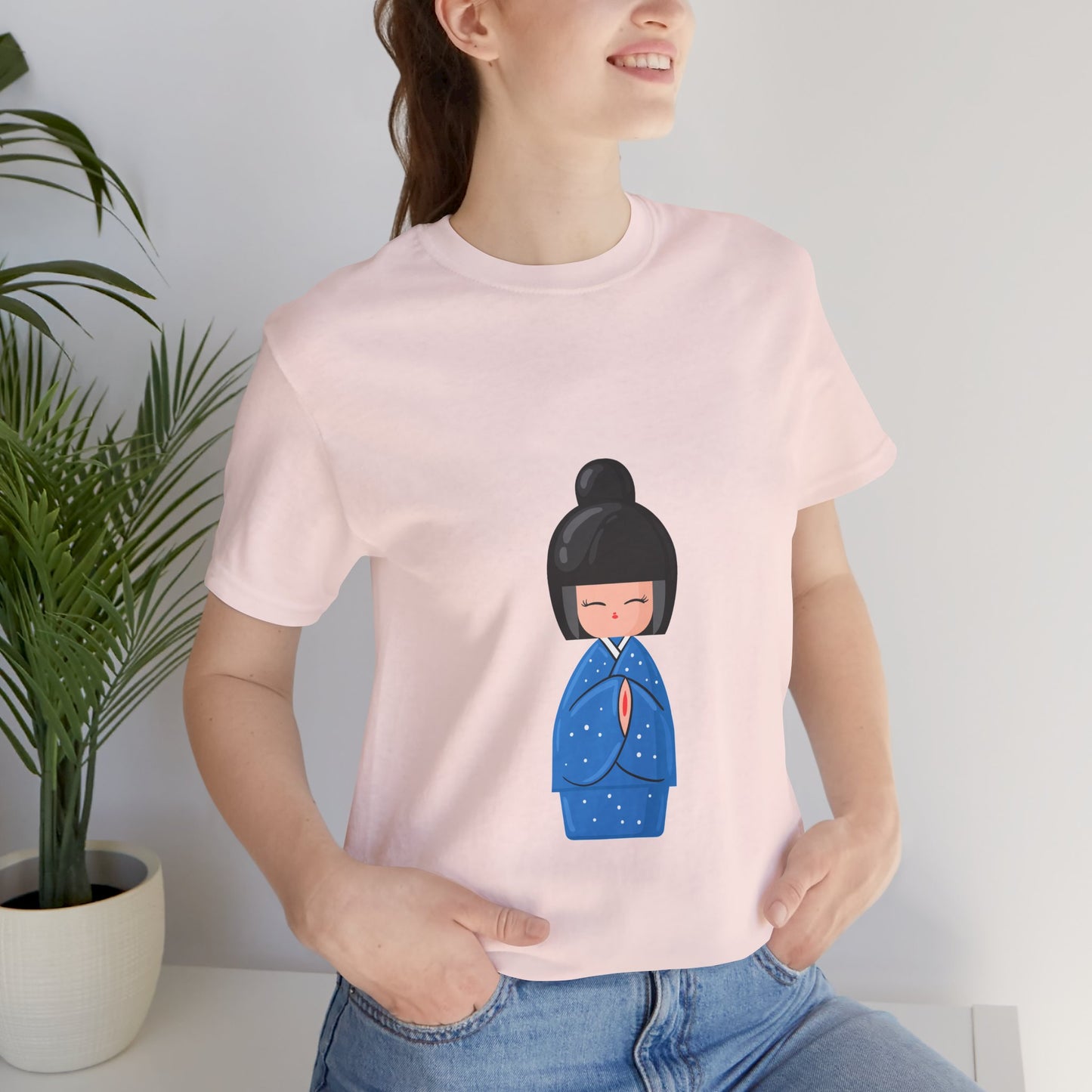 Woman smiling in pink Geisha Blue T-Shirt with rolled sleeves