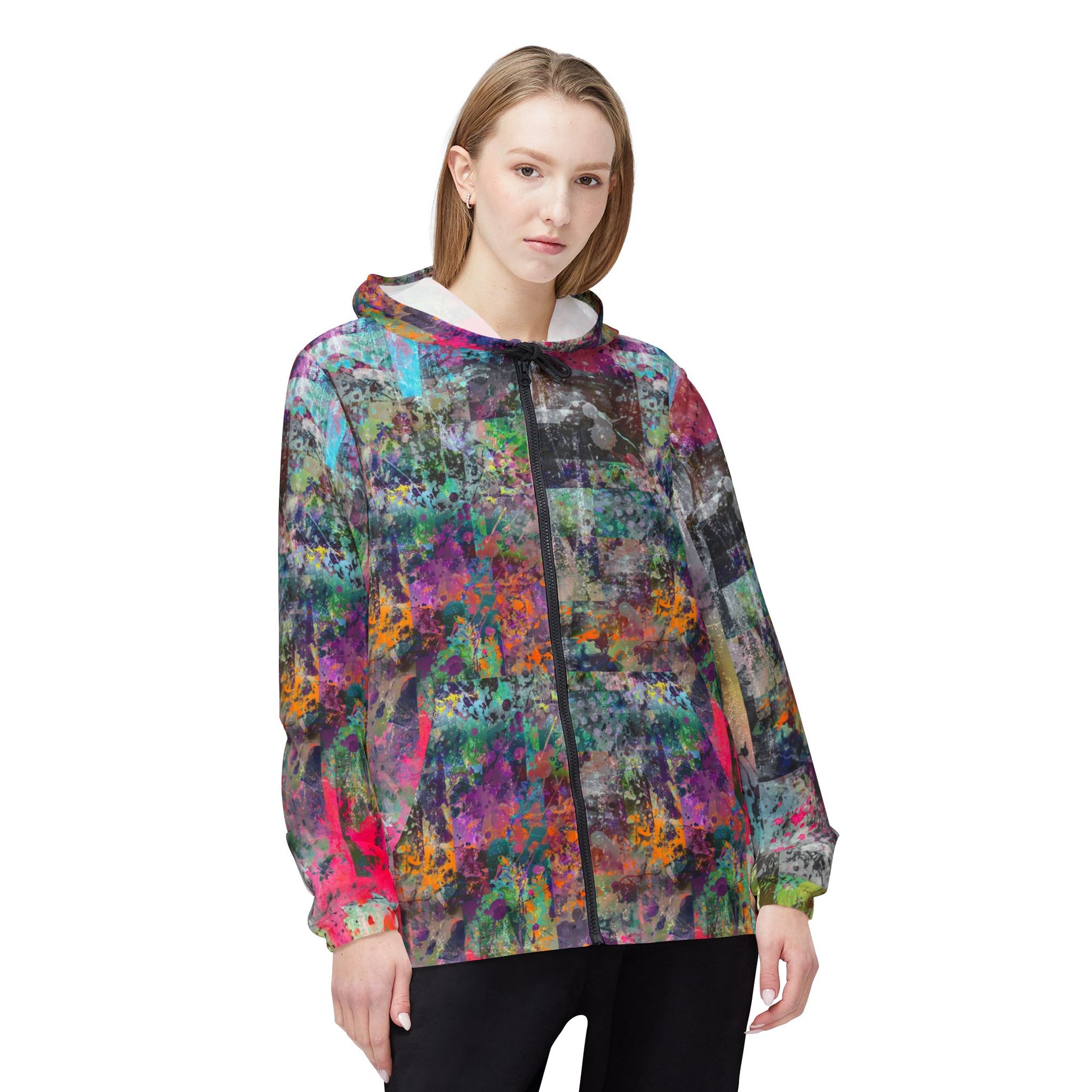 Female model front view wearing Color Splash Windbreaker Jacket with vibrant multicolor pattern.