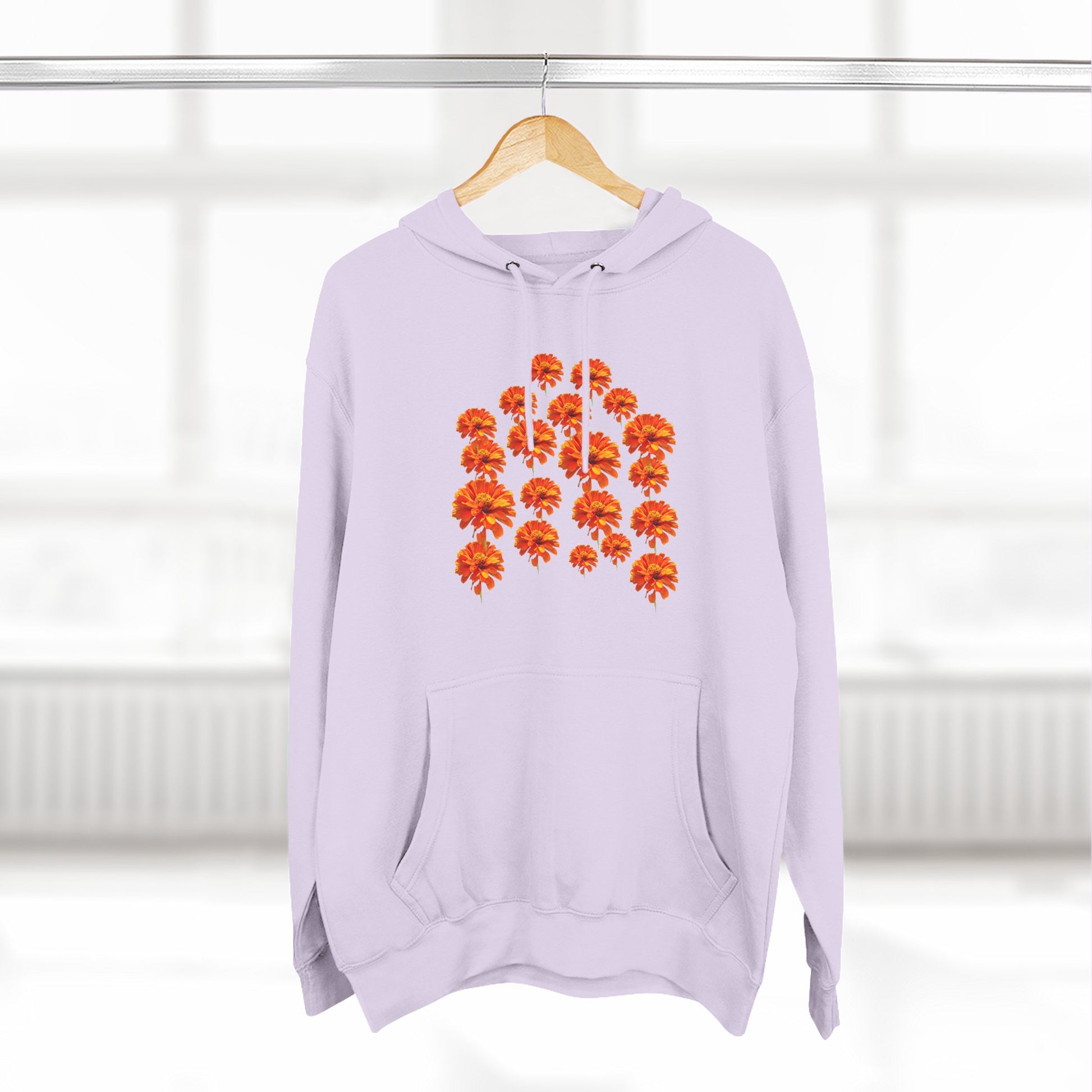 Lavender Zinnia Hoodie on a hanger with orange flower design