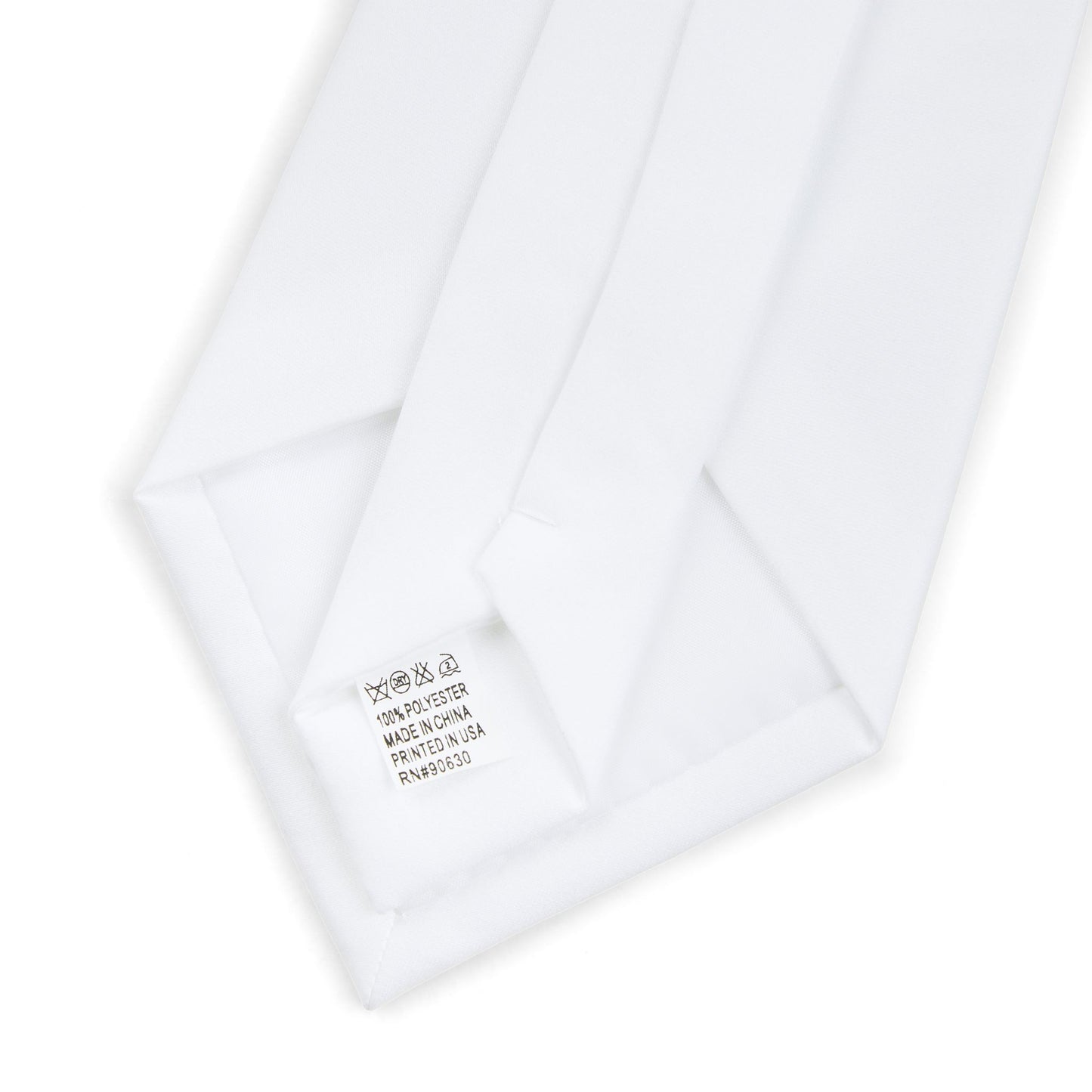 Close up of the back side of the necktie showing the white lining and stitched label.
