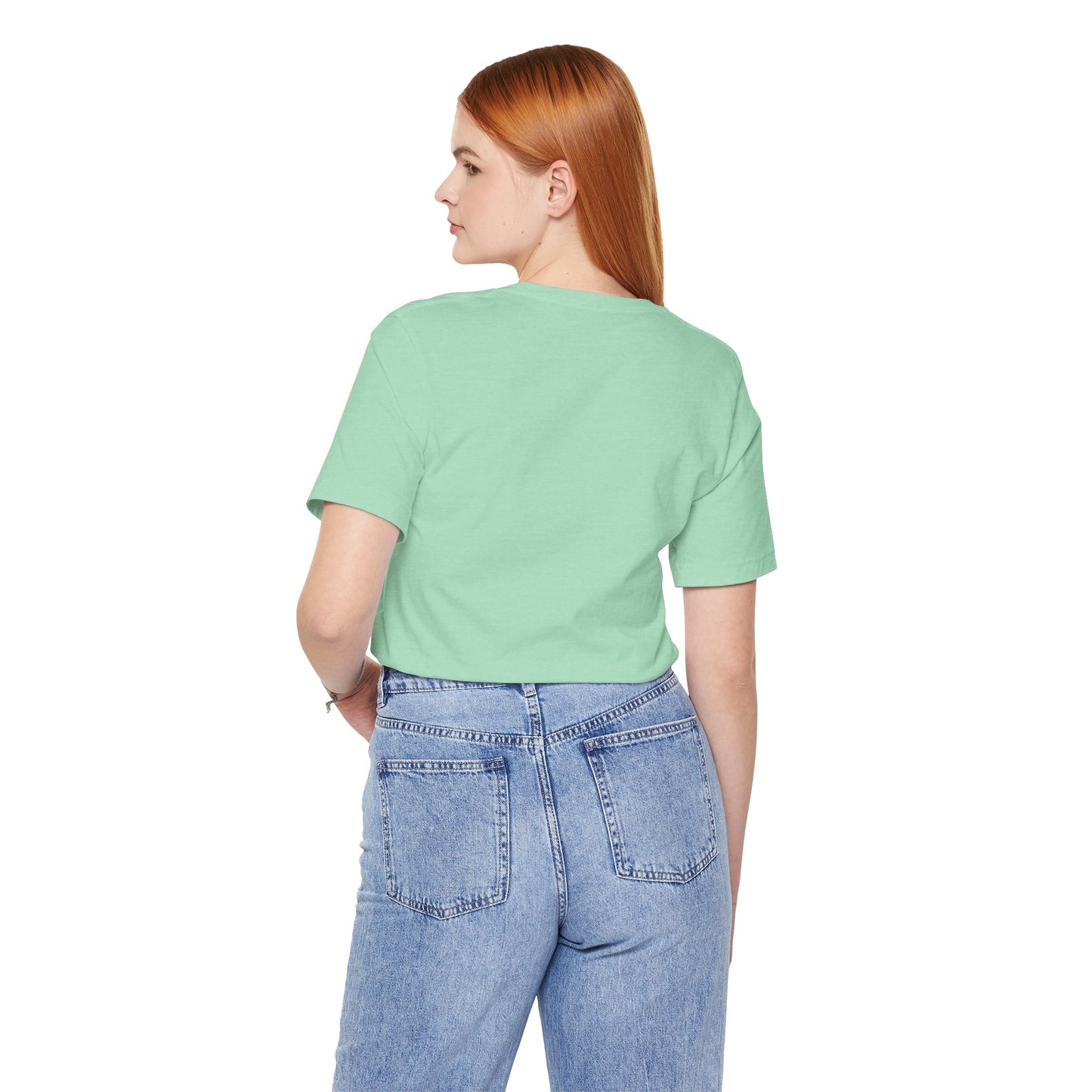 Person wearing a light green t-shirt and blue jeans on a white background