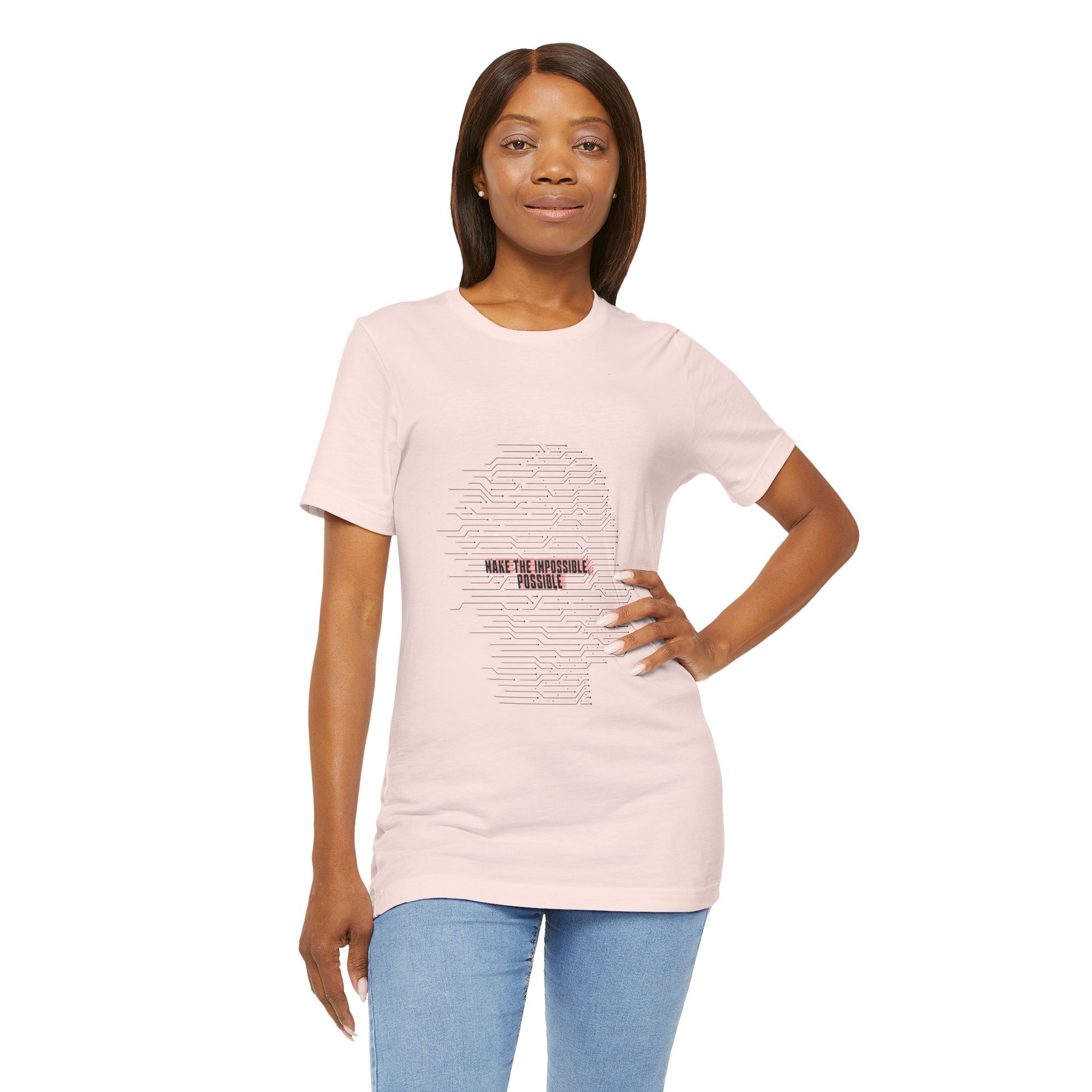 Woman in pink Make It Possible T-Shirt showcasing text design.