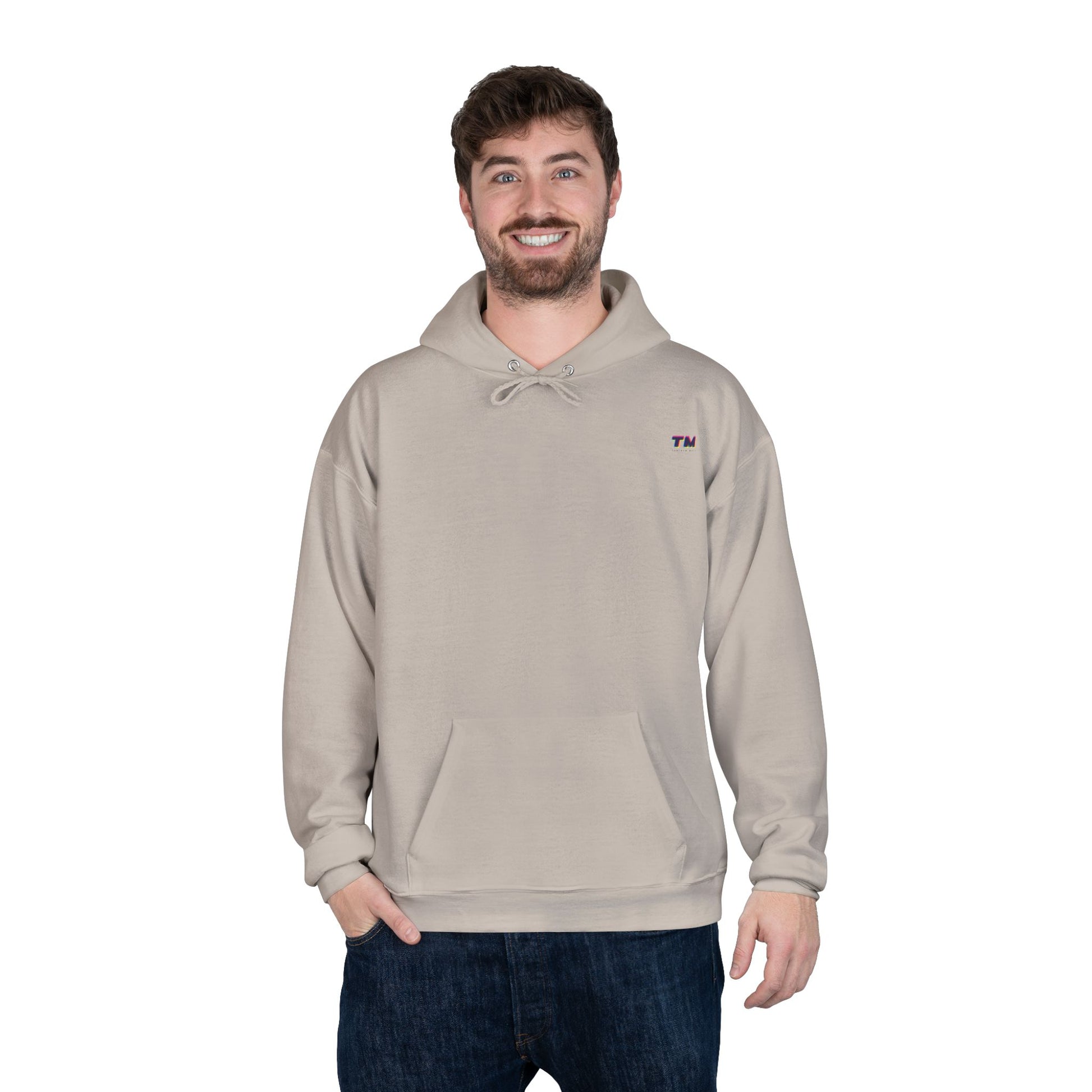 Man wearing beige EcoSmart hoodie with casual stance.